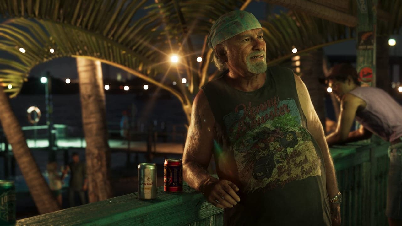 Brian leaning on the rail of a waterfront bar at night in a bandana and cut-off vest, beer cans on the ledge beside him.