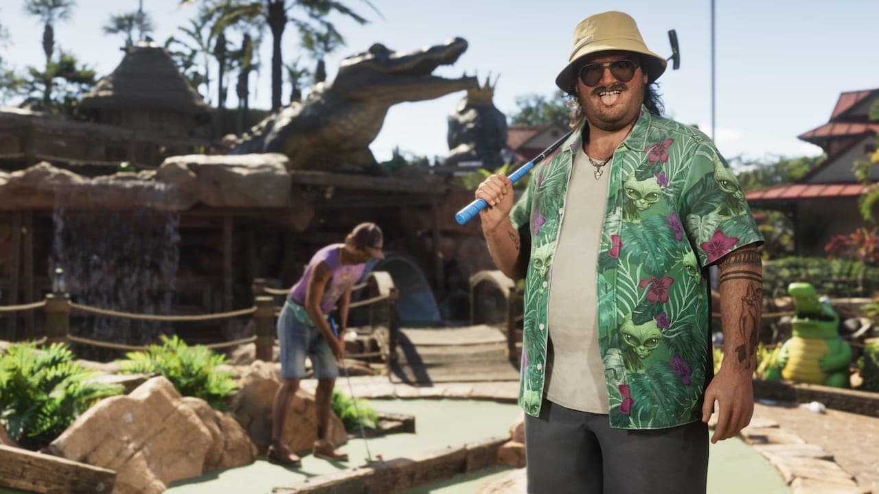 Cal on a crazy golf course in a palm-print shirt and bucket hat, a putter over his shoulder.
