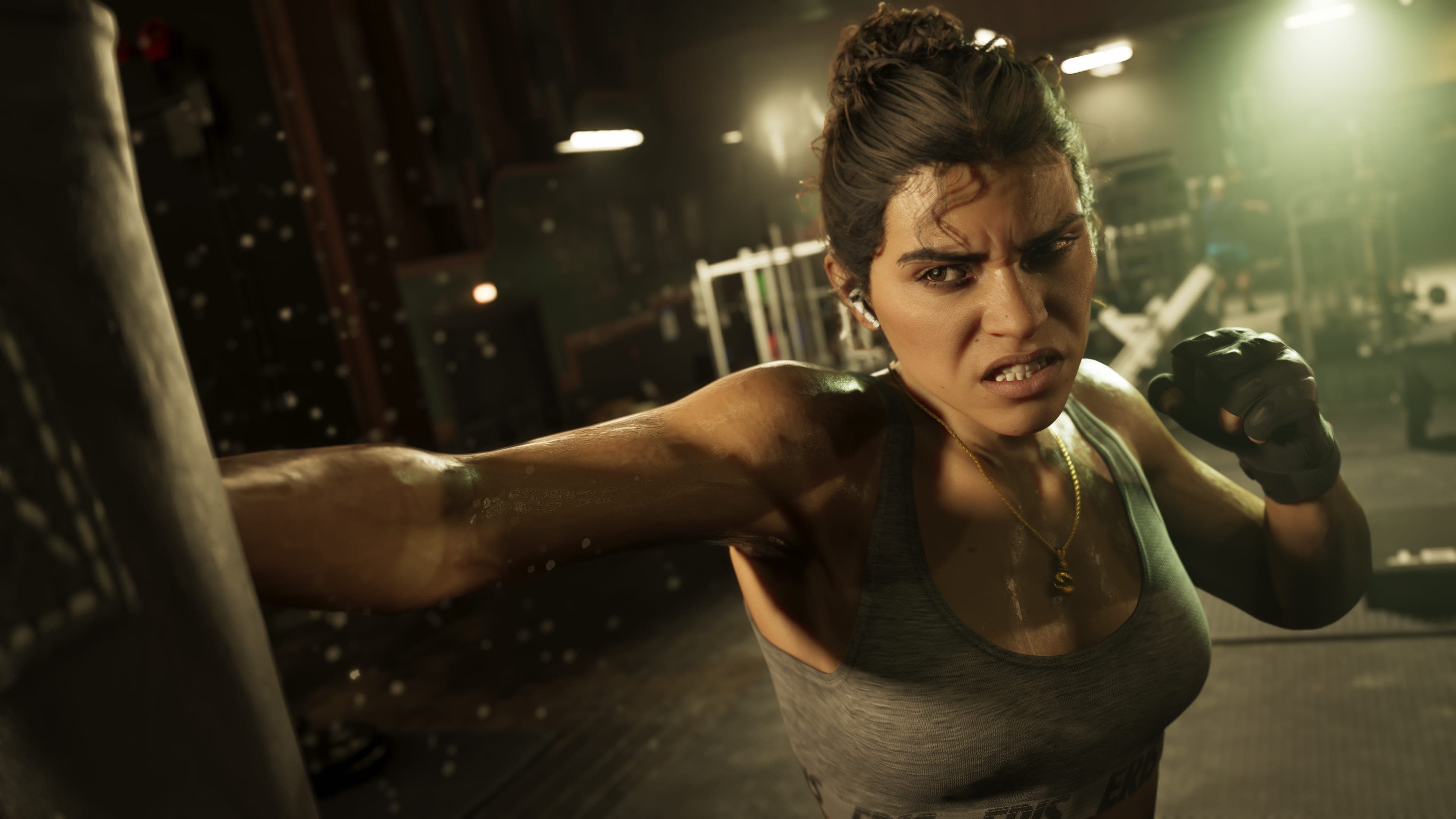 Lucia training in a gym, mid-punch against a heavy bag.