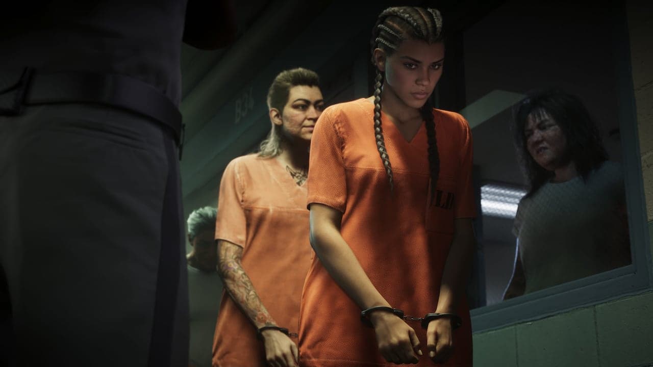 Lucia in an orange prison uniform and handcuffs, walked along a cell block with other inmates behind her.