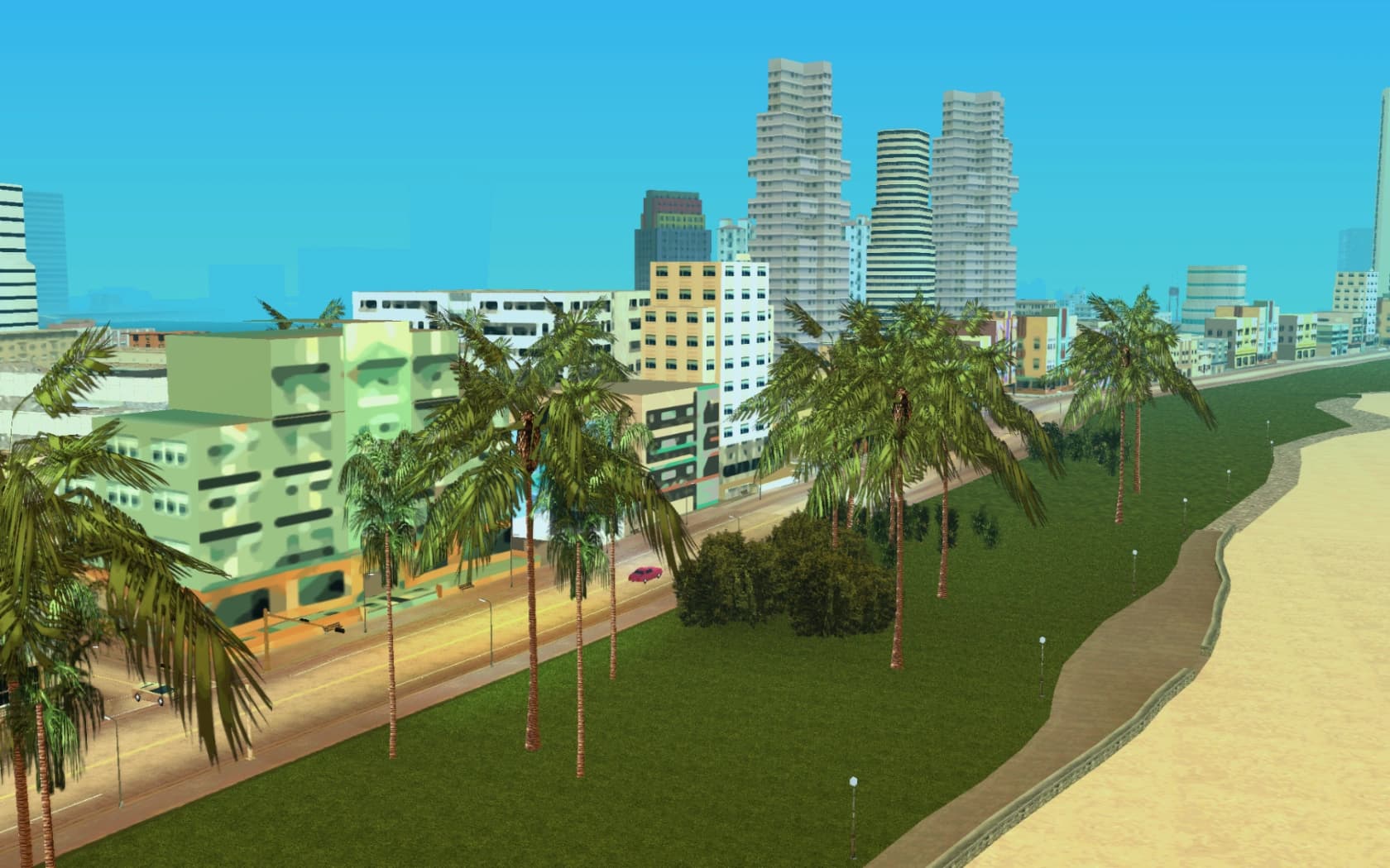 Ocean Beach's art deco frontages and palms above the sand, the sea beyond.
