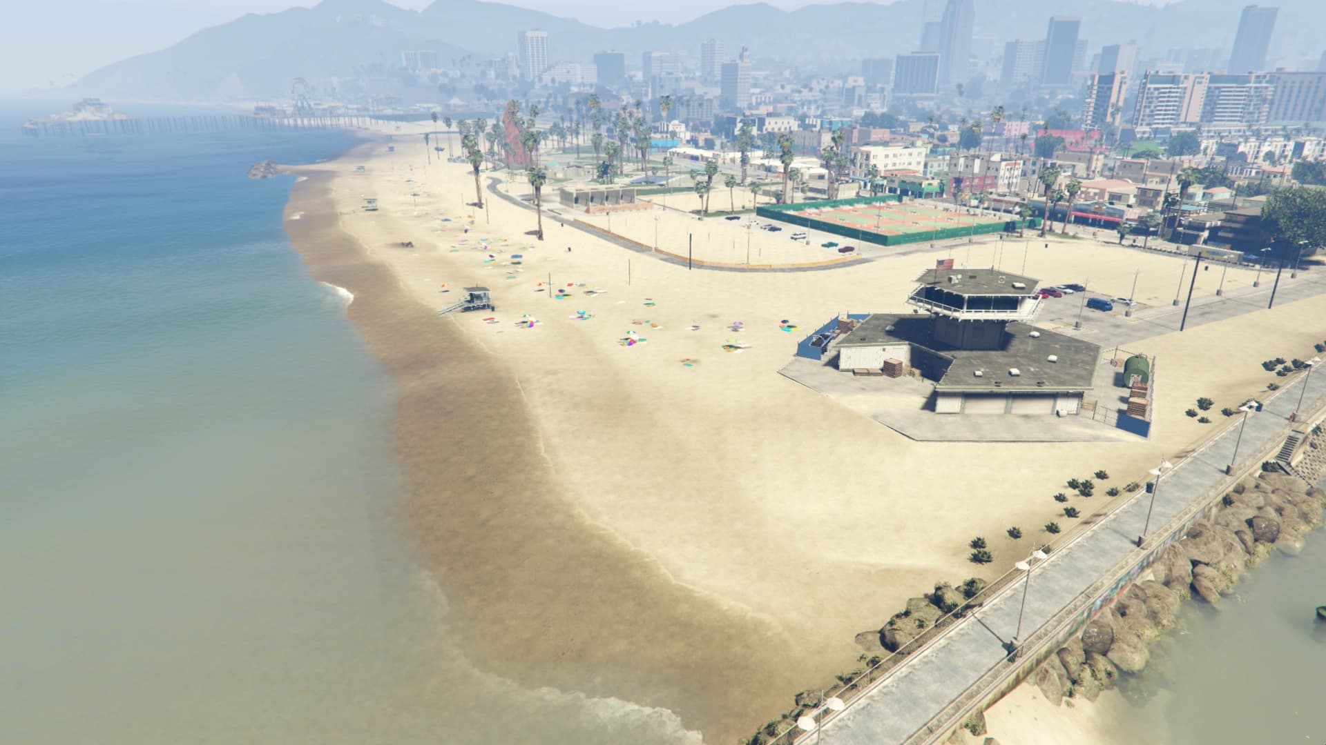 Vespucci Beach from the air, the boardwalk and wide sand running north with the pier in the distance.