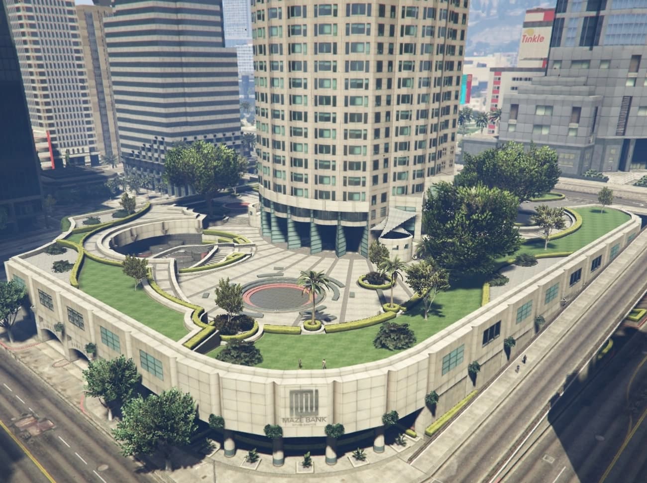 Maze Bank Tower rising above its raised plaza and gardens in Pillbox Hill, the bank’s name over the entrance below.
