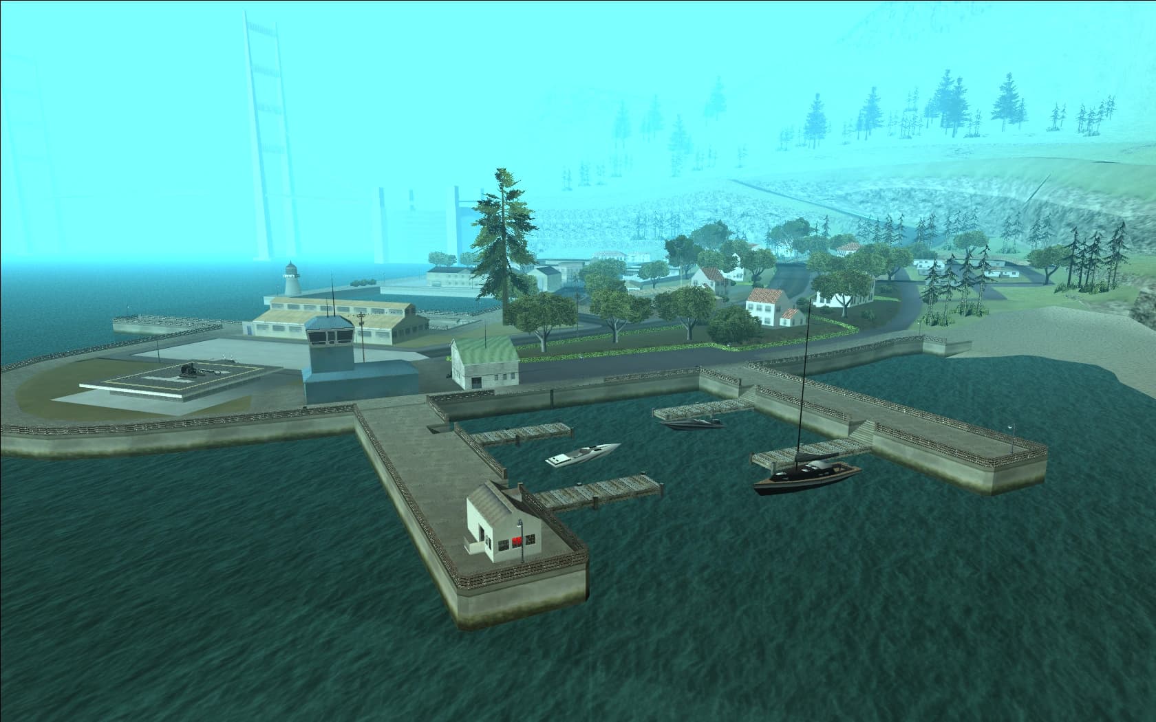 The marina at Bayside in Tierra Robada, jetties and moored boats below wooded hills with the Gant Bridge towers in the haze.