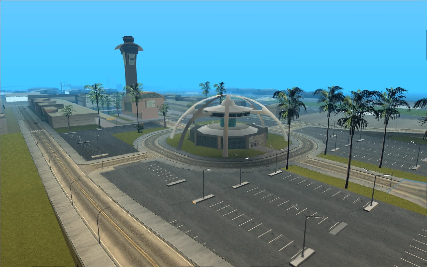 Los Santos International Airport, its arched terminal canopy and control tower beside the coast.