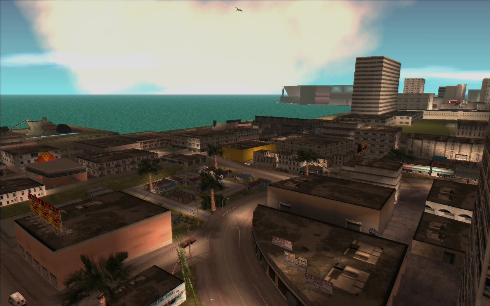 Little Haiti, low houses and workshops with palms between them and the sea beyond.