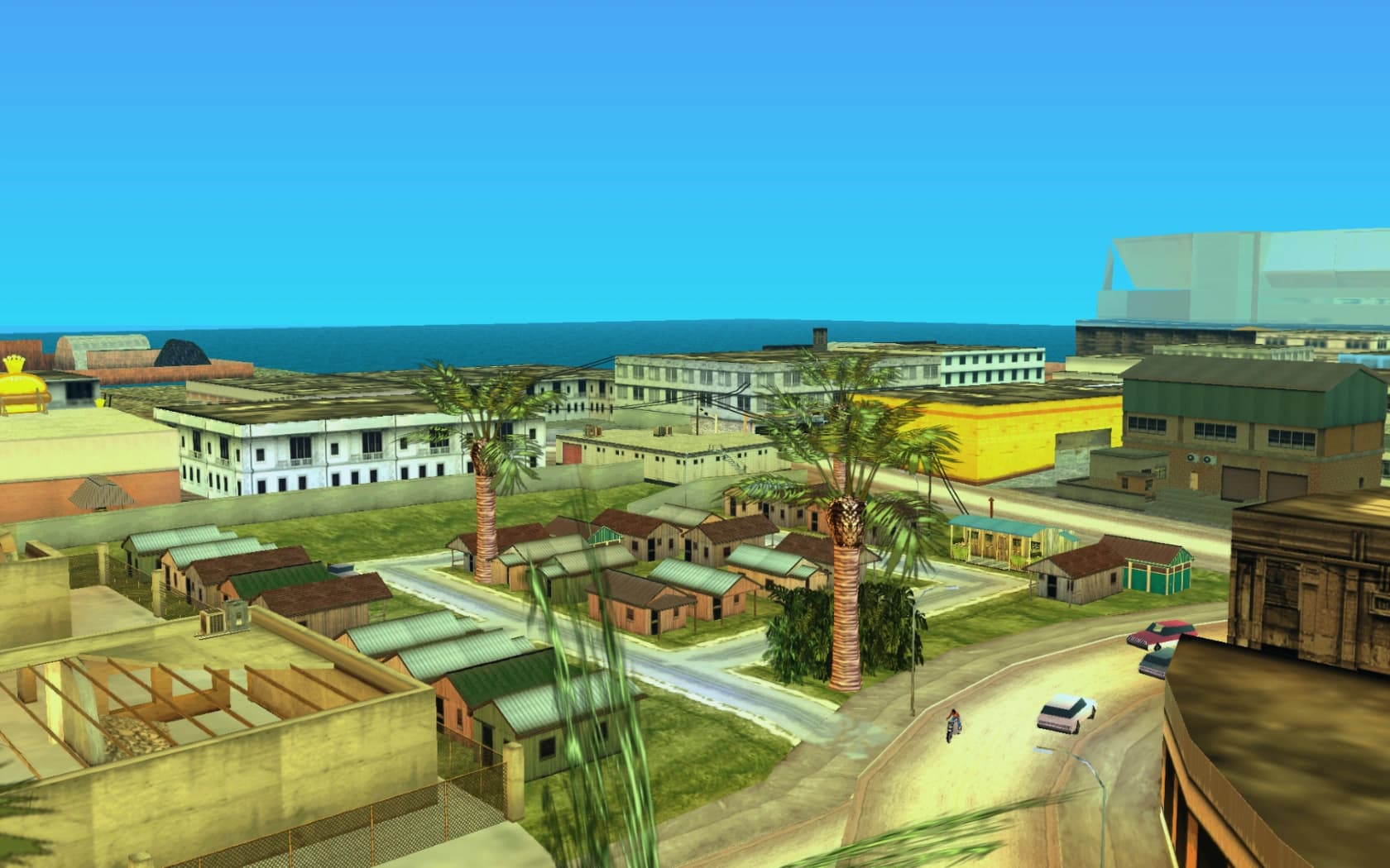 Little Haiti's low wooden houses and yards, palms rising between the roofs.