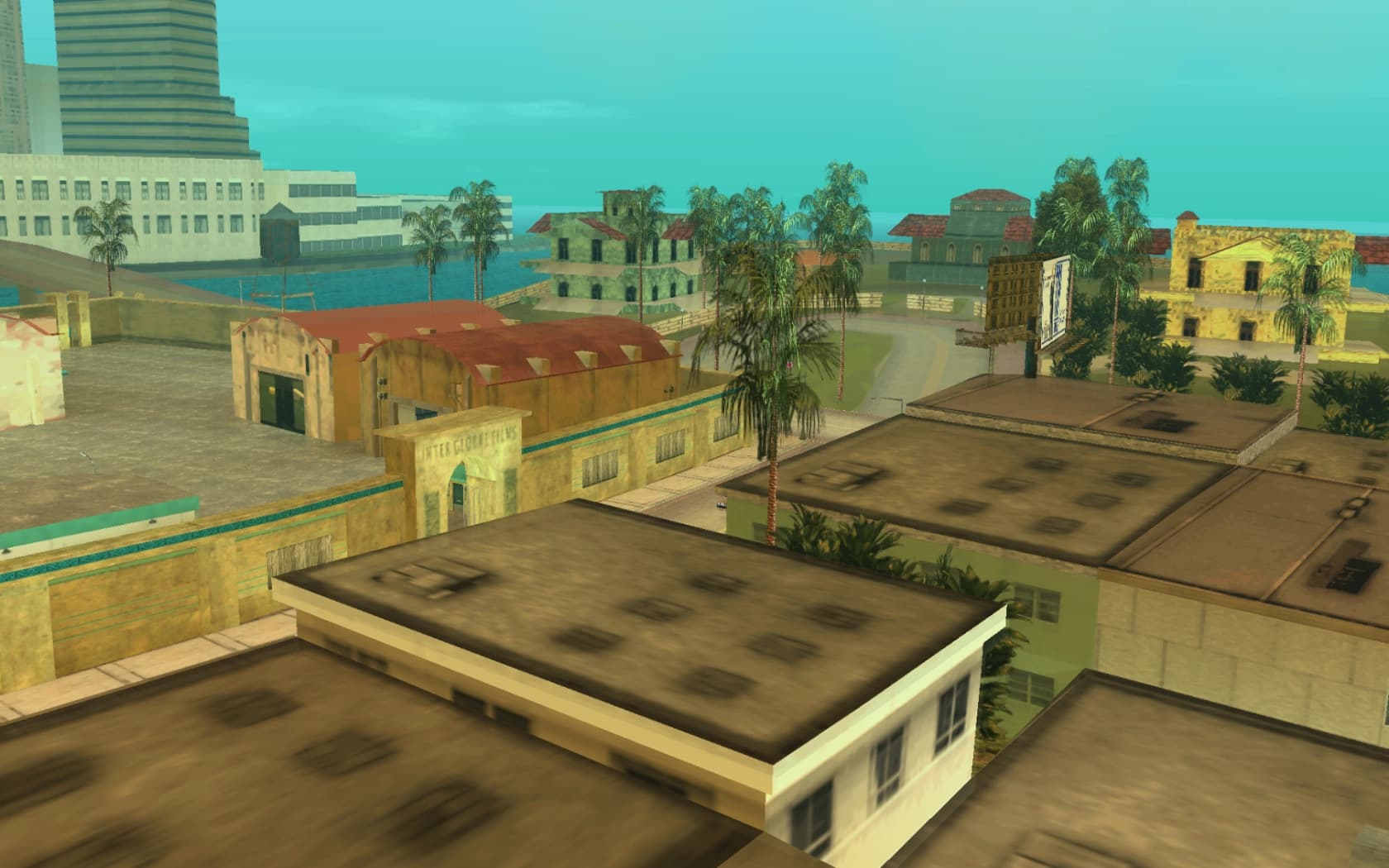 Prawn Island's studio buildings and yards, largely derelict, ringed by water.