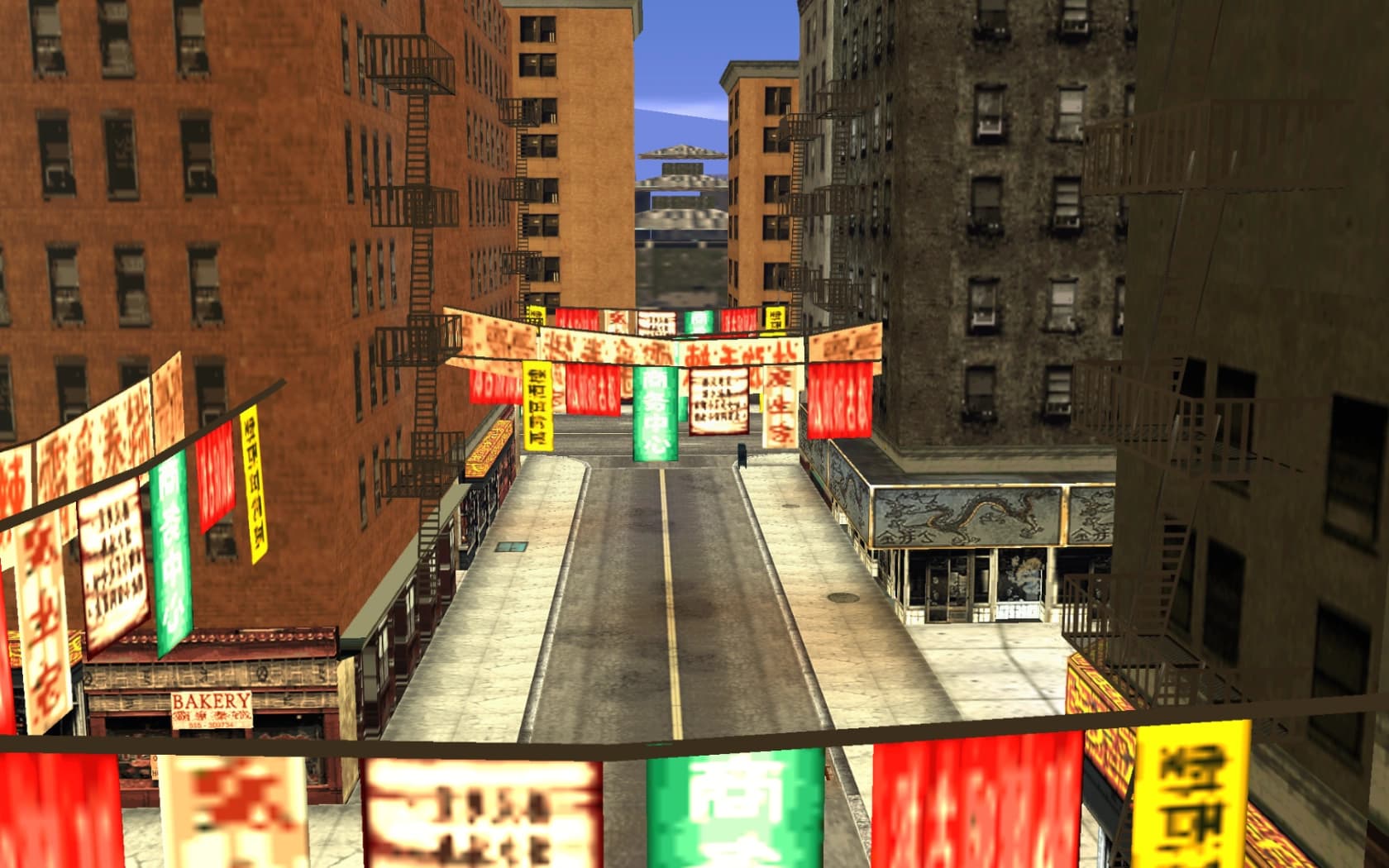 Chinatown on Portland, banners strung above the road with shopfronts and a bakery along one side.