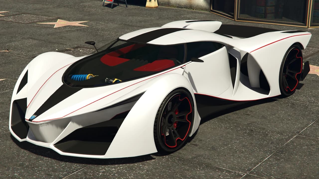 A white and black Grotti X80 Proto with red detailing, parked on a plaza.