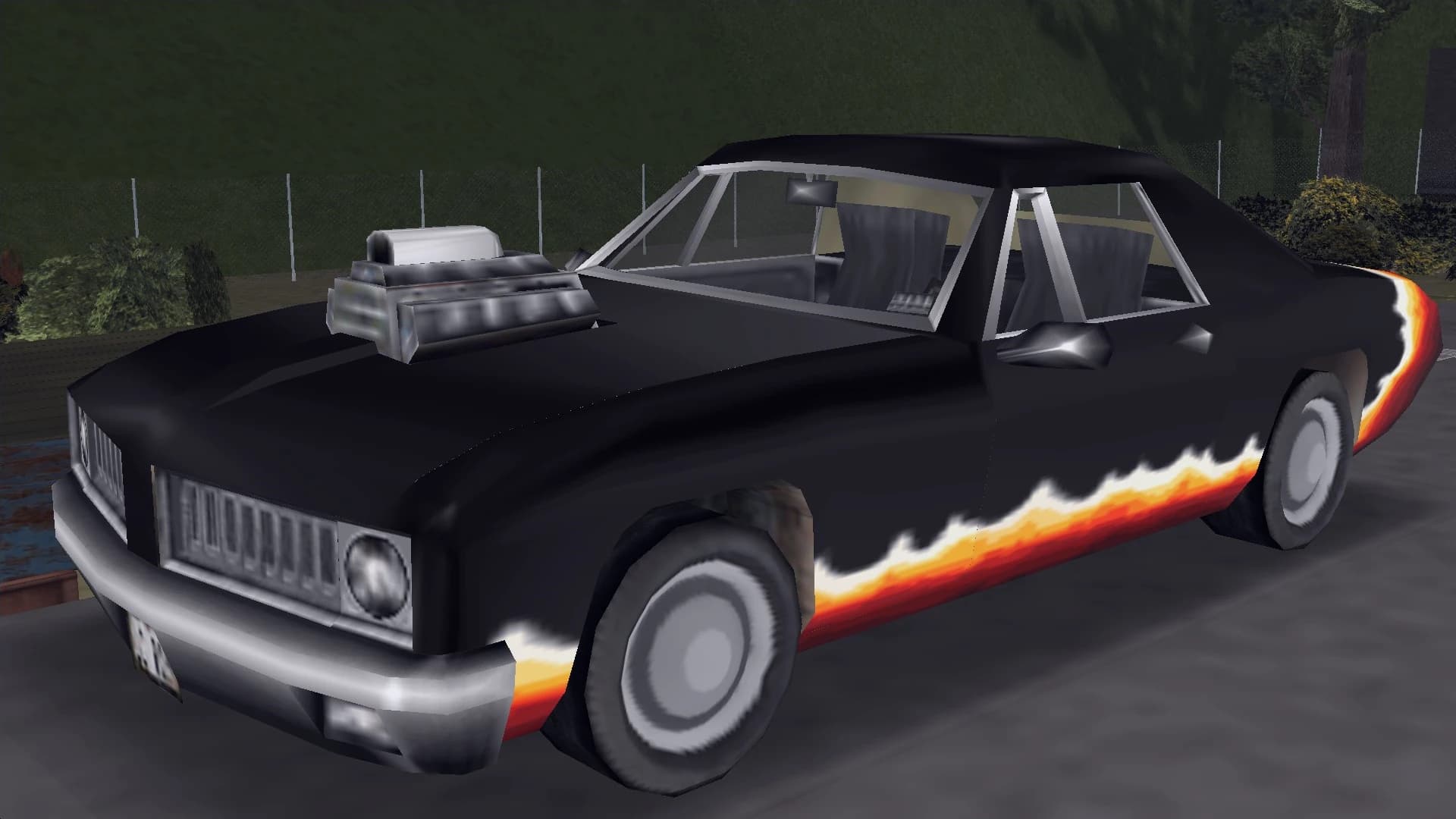 A black Diablo Stallion with orange flame graphics and an exposed supercharger, front three-quarter view.