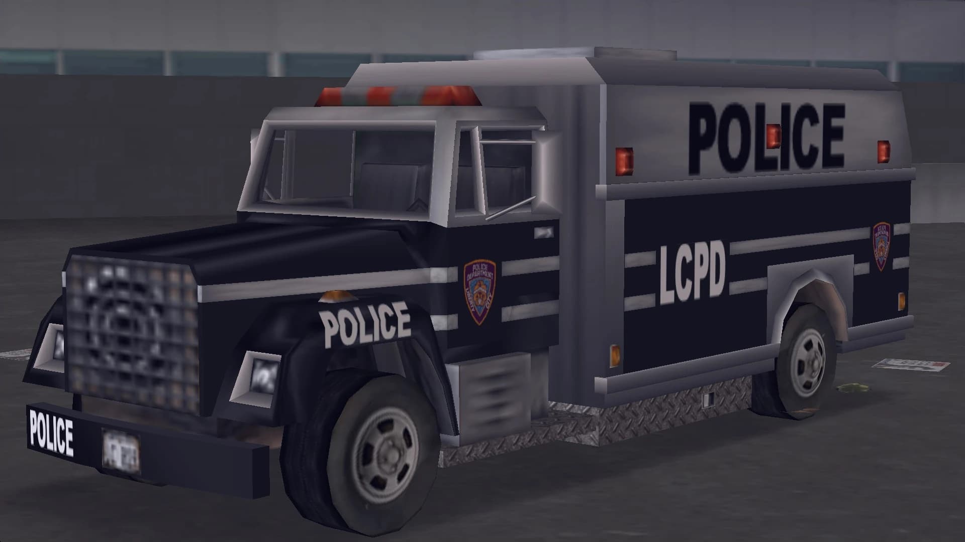 A dark blue LCPD Enforcer riot van lettered POLICE, front three-quarter view.