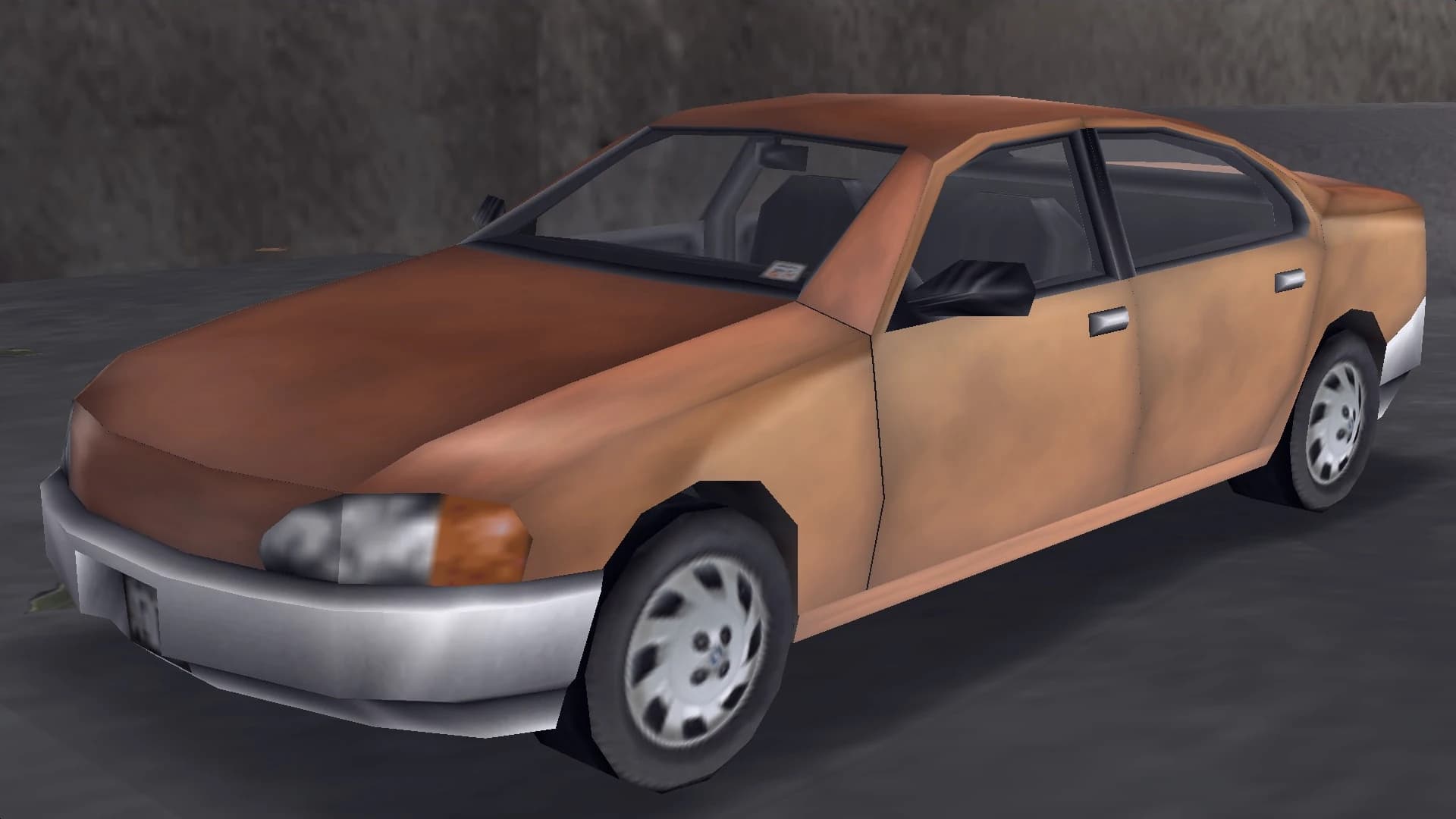 A tan Kuruma saloon, front three-quarter view.