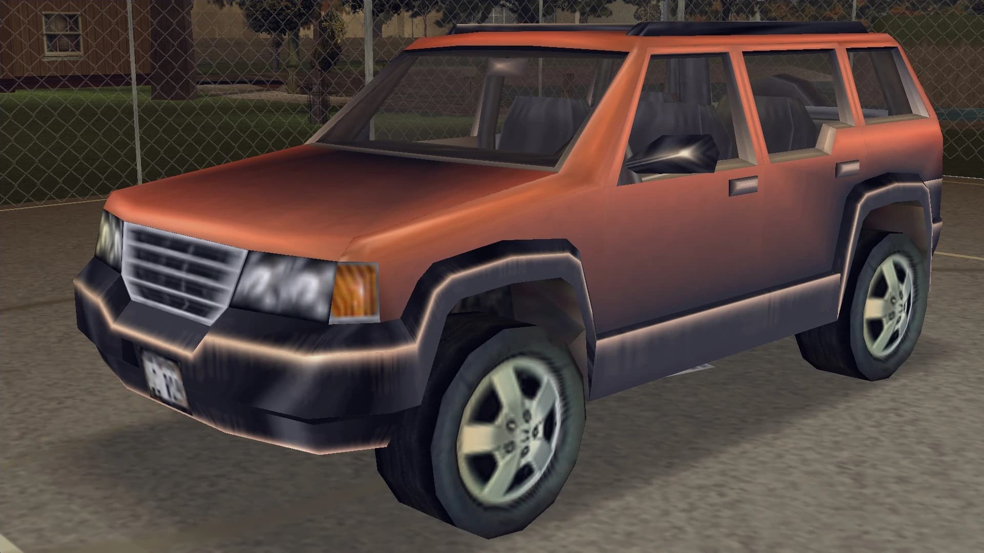 An orange Landstalker four-by-four, front three-quarter view.