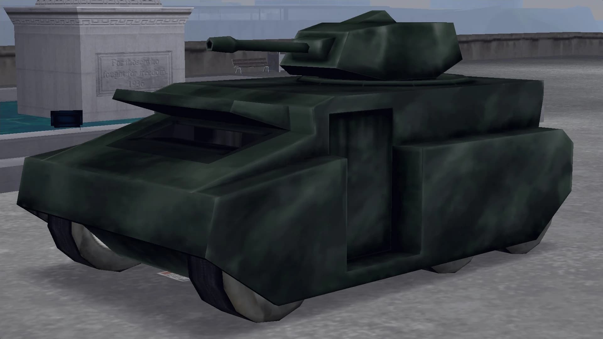 A dark green Rhino tank with its turret trained forward, front three-quarter view.