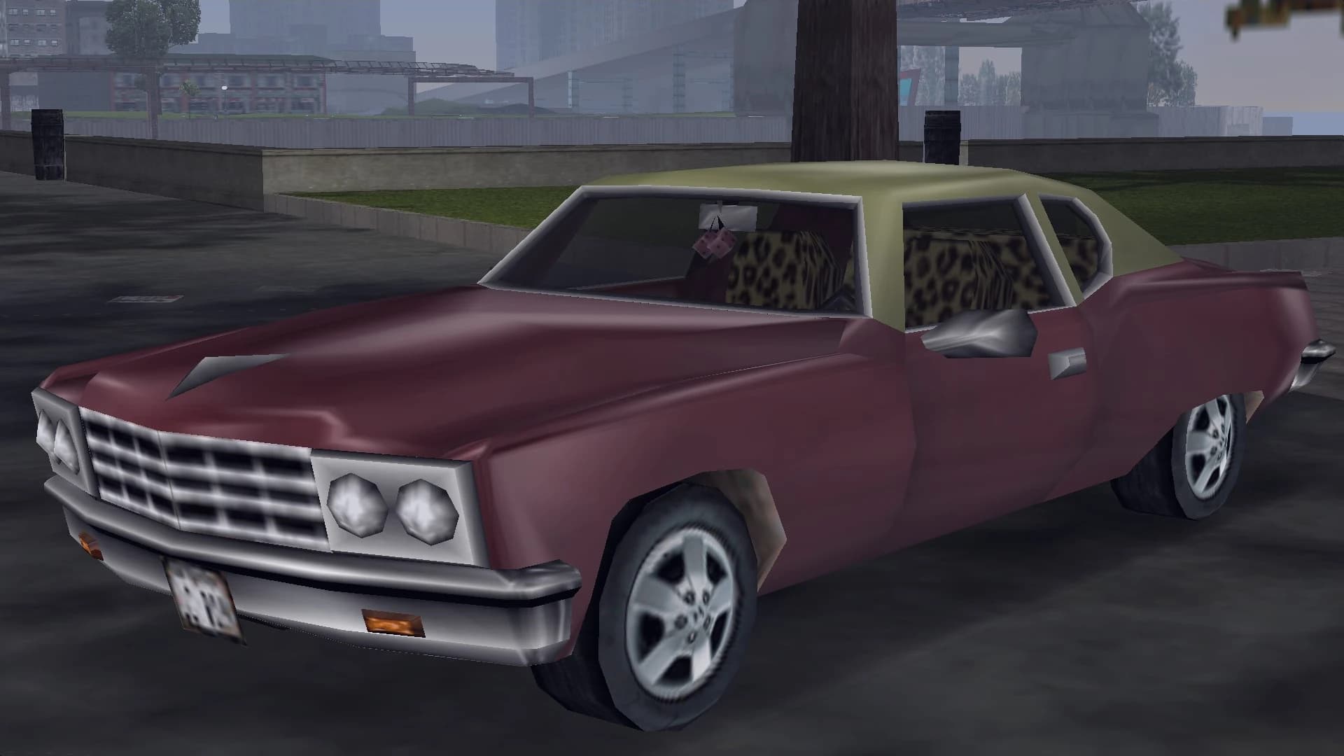 A maroon Yardie Lobo lowrider with a cream roof and leopard-print seats, front three-quarter view.