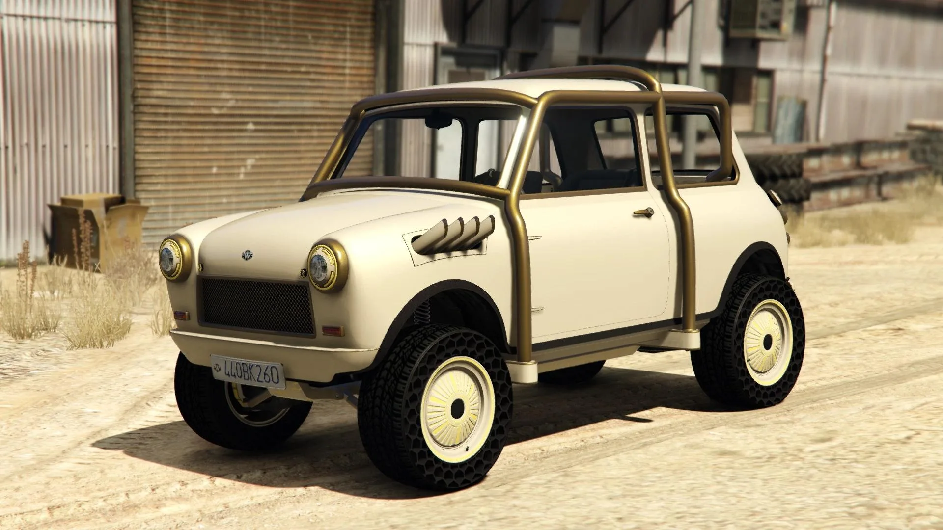 The Weeny Future Shock Issi, a cream classic city car with a gold roll cage and white wheels, parked by a warehouse, in GTA Online.