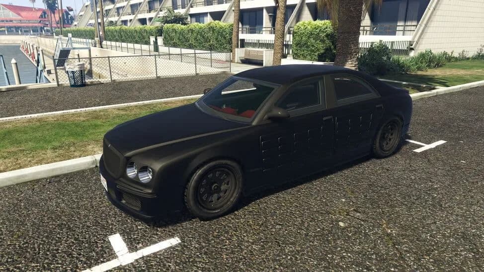 The Enus Cognoscenti 55 (Armored), a matte black luxury saloon with armour panels on its doors, parked beside a lawn, in GTA Online.