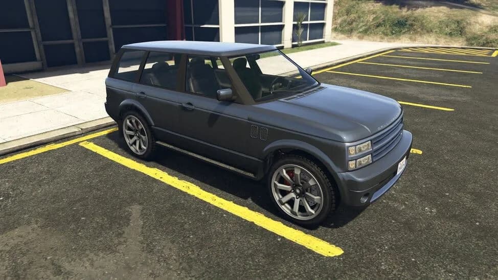 The Gallivanter Baller, a grey 2000s luxury SUV, parked in a car park, in GTA Online.