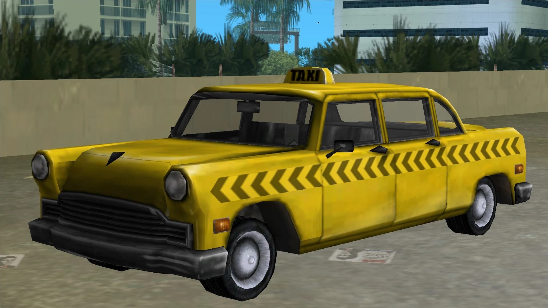 A yellow Cabbie with a chevron side stripe and a TAXI roof sign, front three-quarter view.