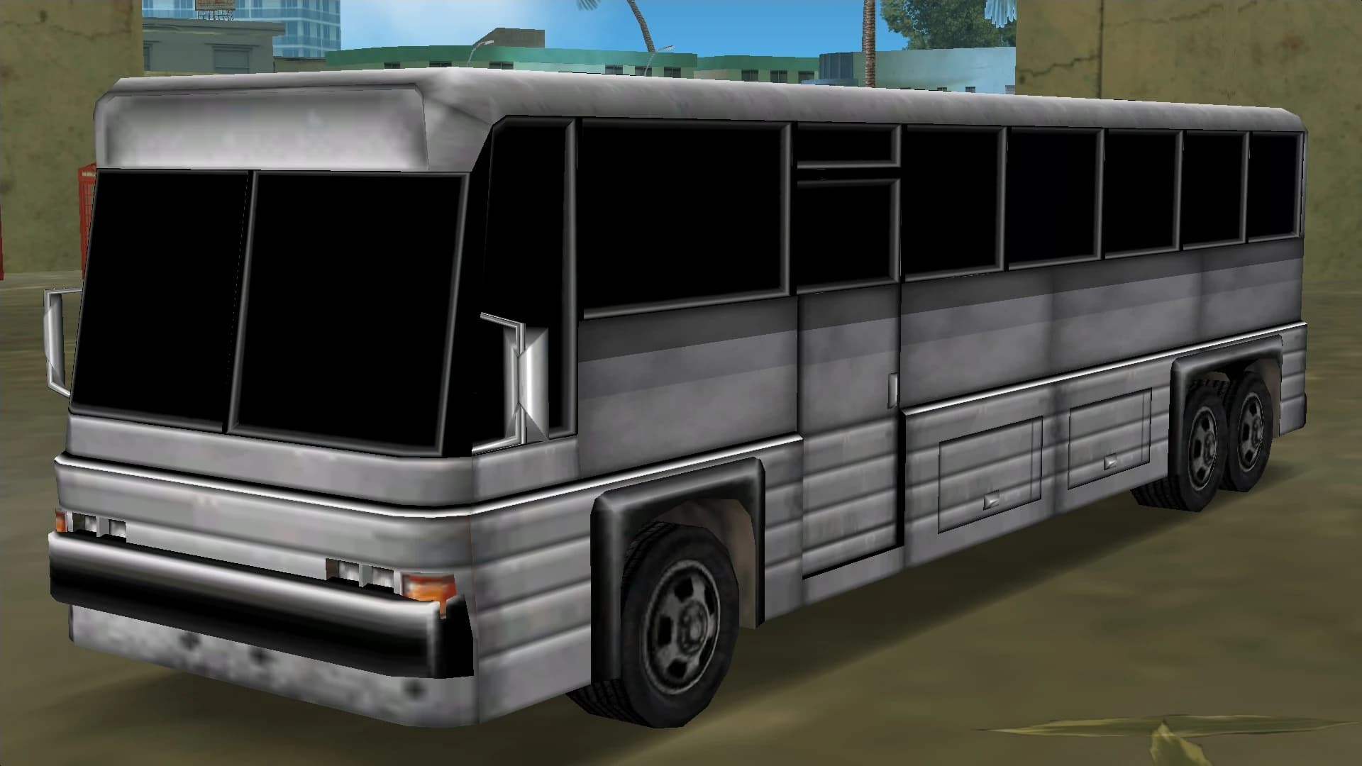A silver Coach, front three-quarter view.