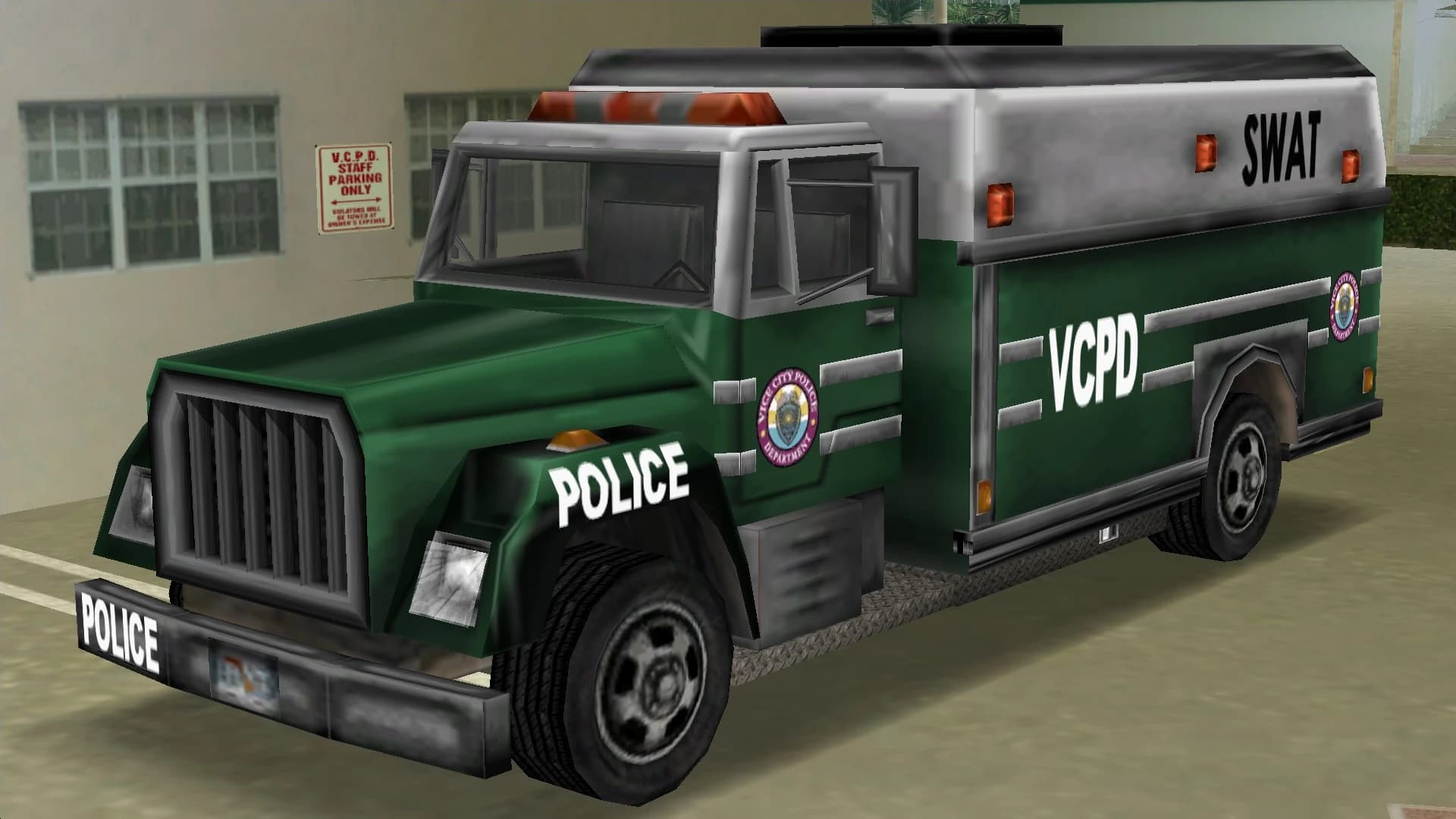 A green and white VCPD Enforcer SWAT truck, front three-quarter view.