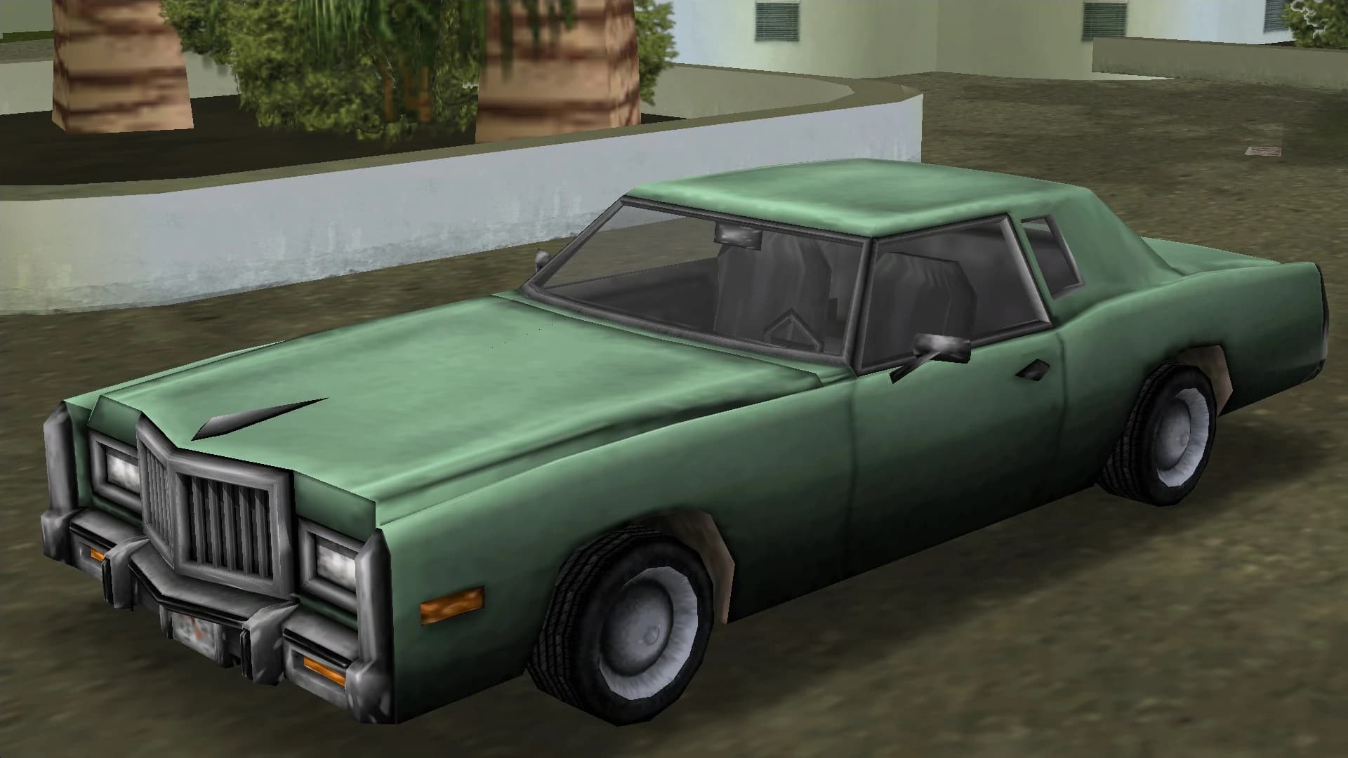 A green Esperanto coupe, front three-quarter view.