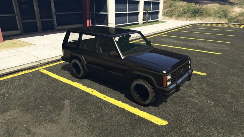 The Canis Seminole Frontier, a black boxy 1980s SUV, parked in a car park, in GTA Online.