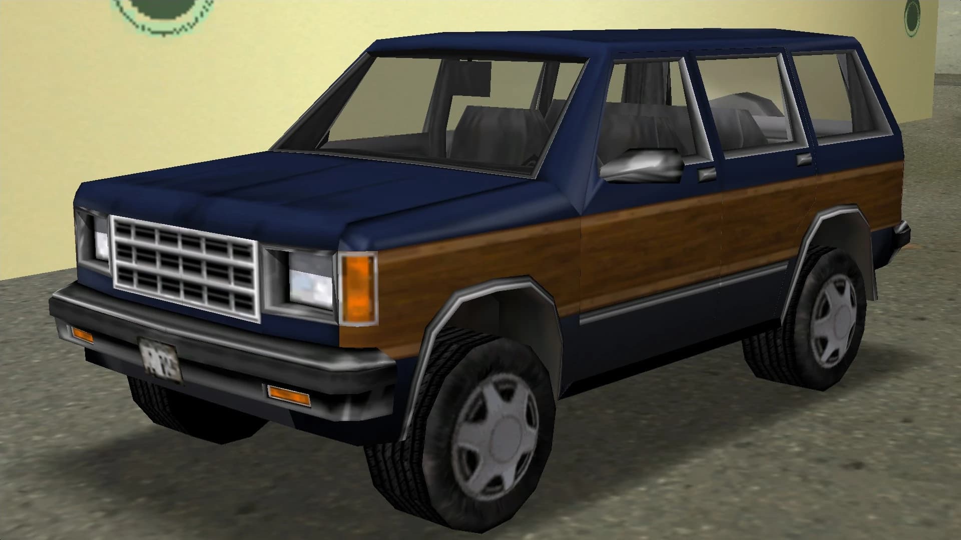 A navy Landstalker four-by-four with wood-effect side panelling, front three-quarter view.