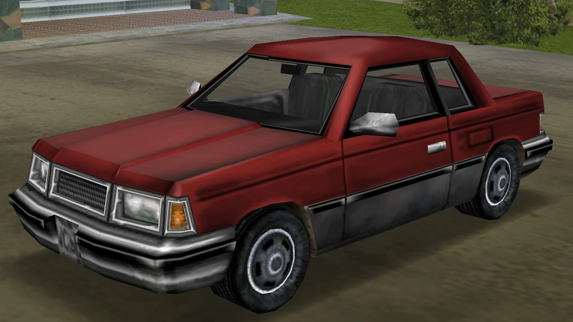 A red Manana coupe, front three-quarter view.