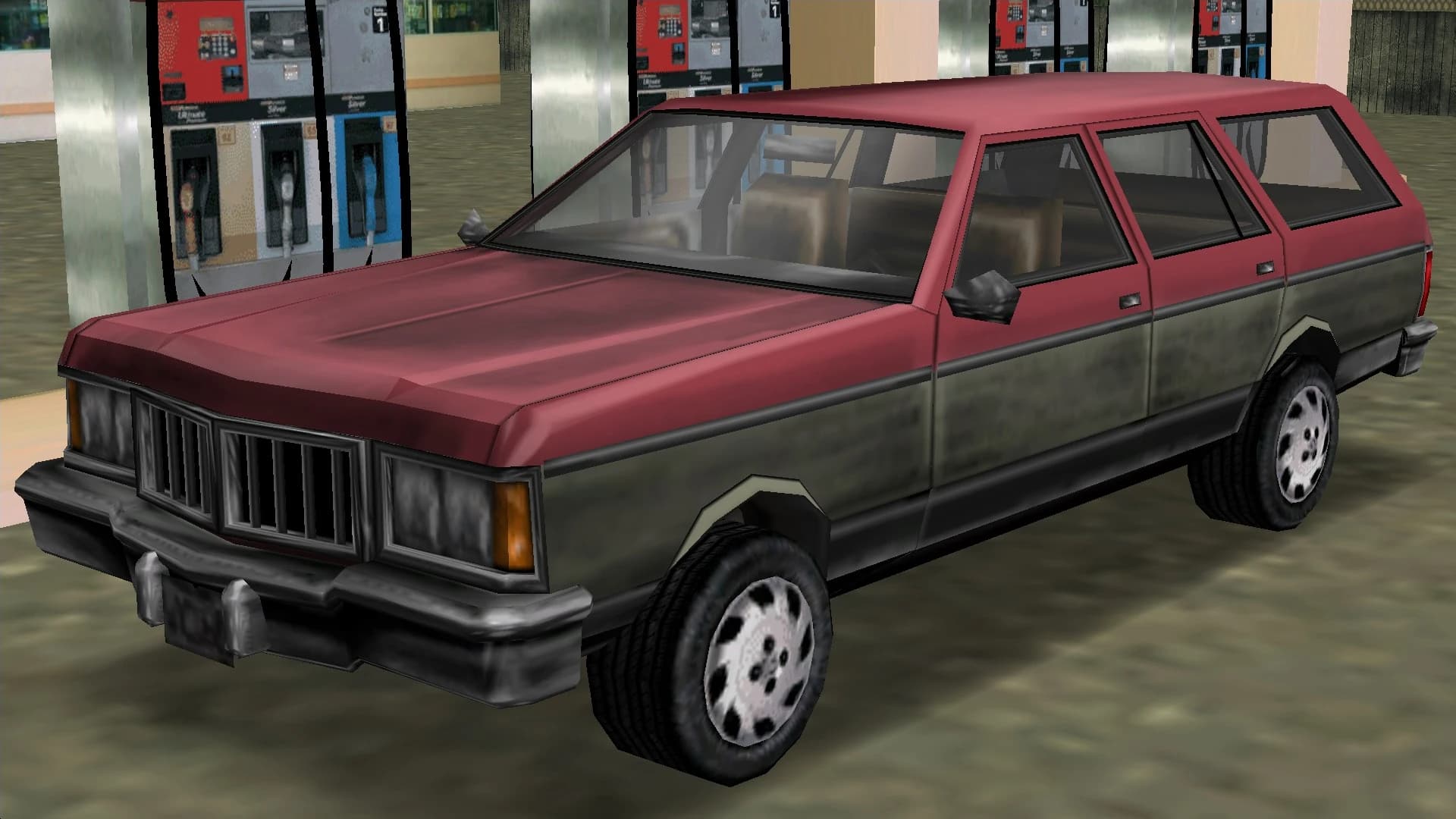 A maroon and grey Regina estate, front three-quarter view.