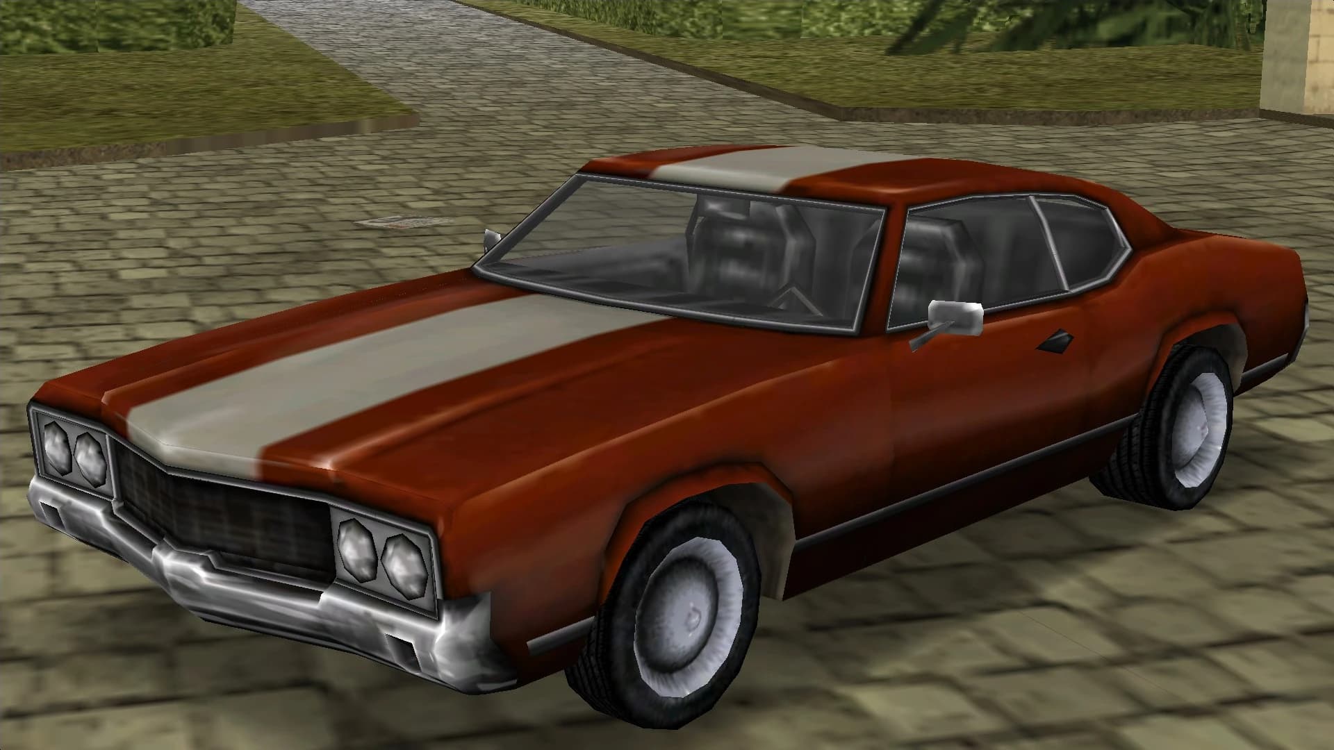A red Sabre Turbo with a white centre stripe, front three-quarter view.