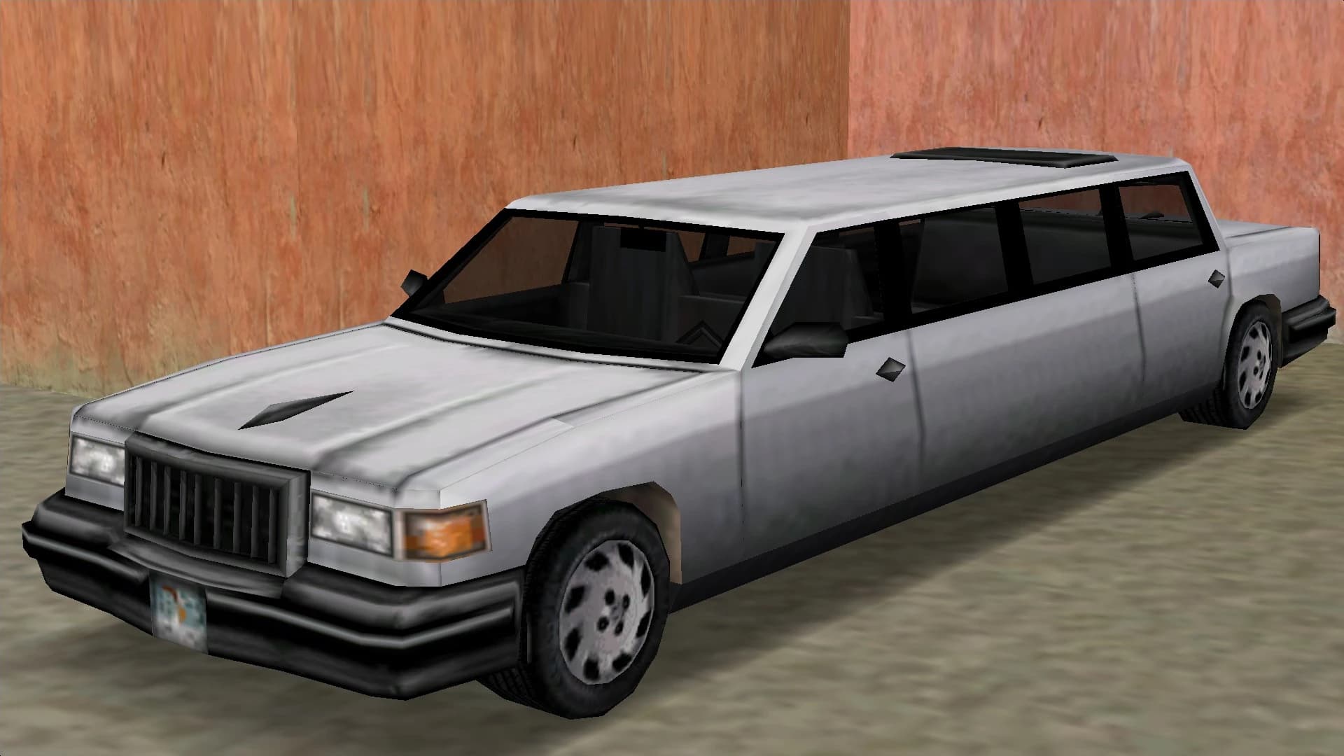 A silver Stretch limousine, front three-quarter view.