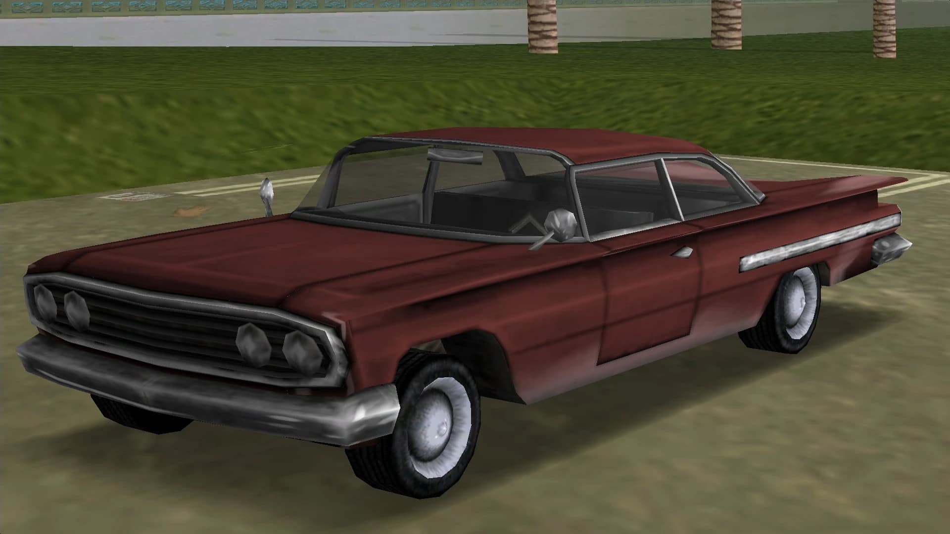 A maroon Voodoo lowrider with a finned rear, front three-quarter view.