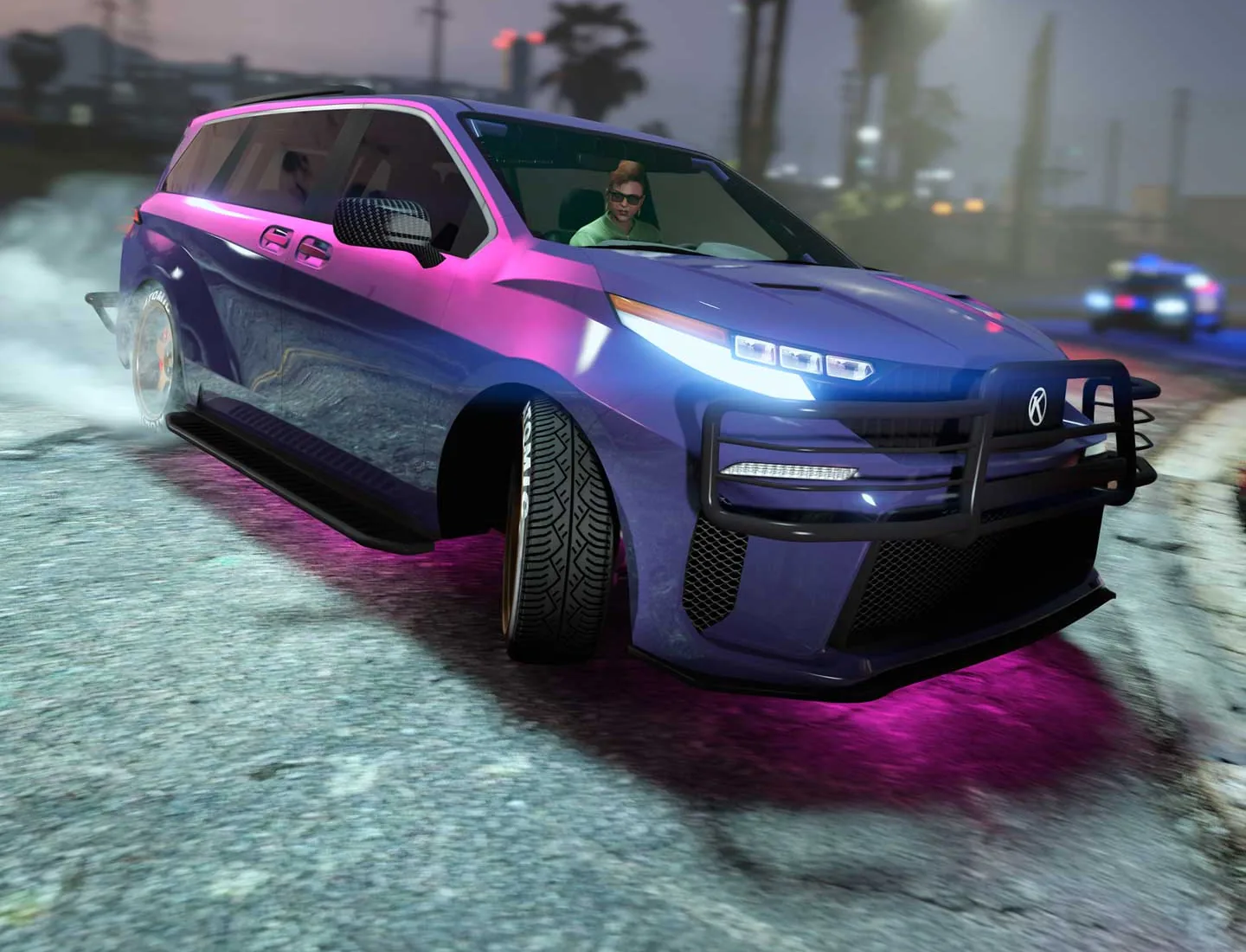 A purple and pink Karin Vivanite people carrier with a bull bar and pink underglow, in GTA Online.
