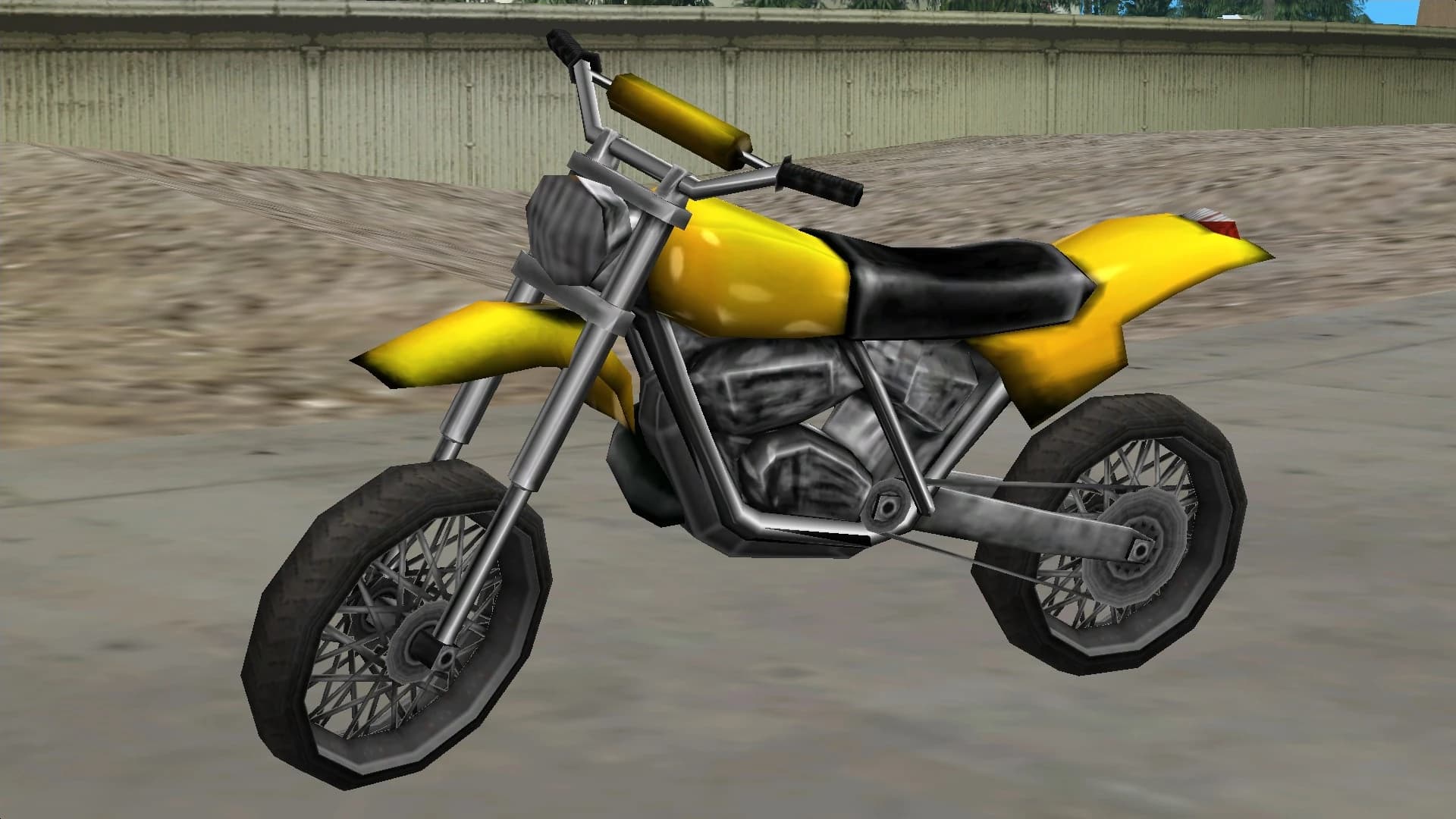A yellow Sanchez dirt bike, side view.