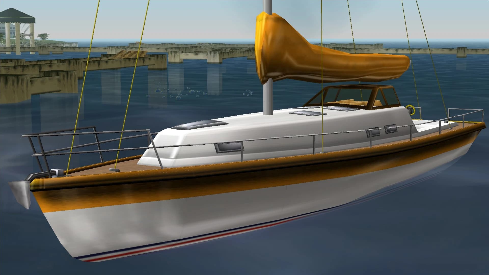 A white Marquis sailing yacht with its sail furled, moored on the water.