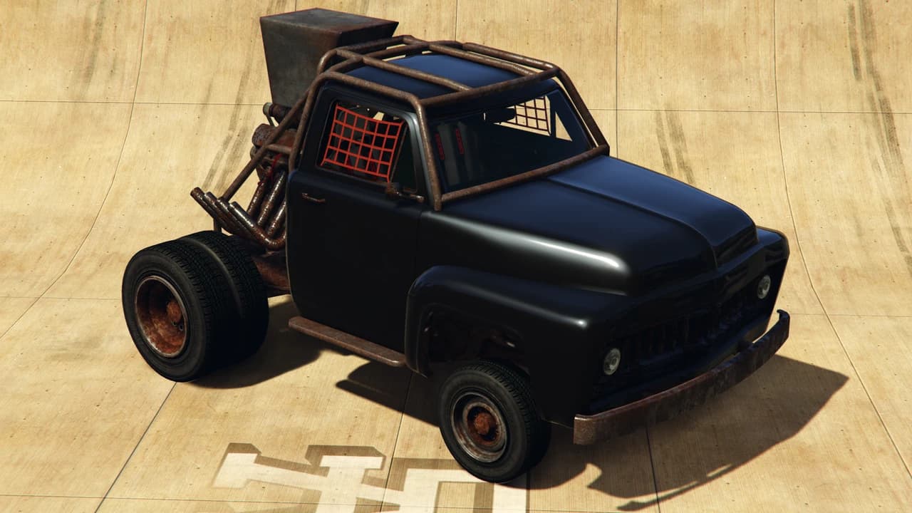 A black Vapid Apocalypse Slamvan with a roll cage and exposed exhaust stacks, front three-quarter view.