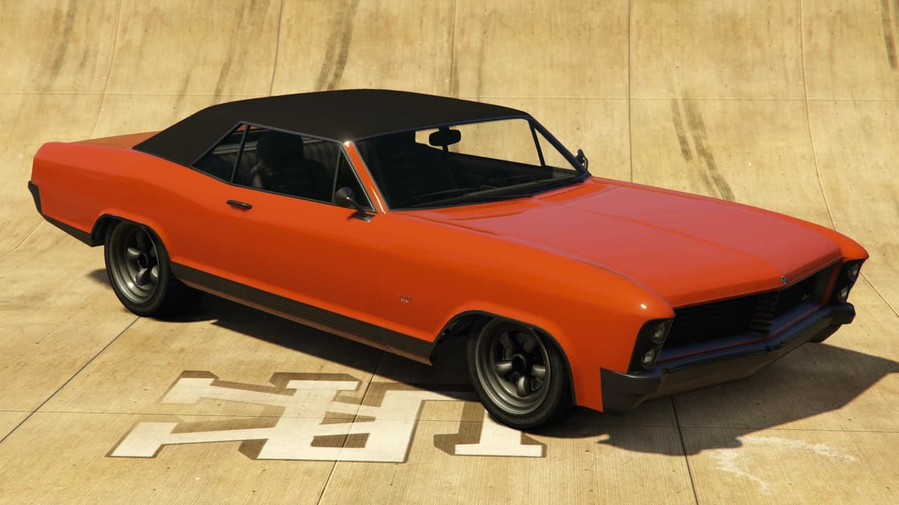 An orange Albany Buccaneer with a black vinyl roof, front three-quarter view.