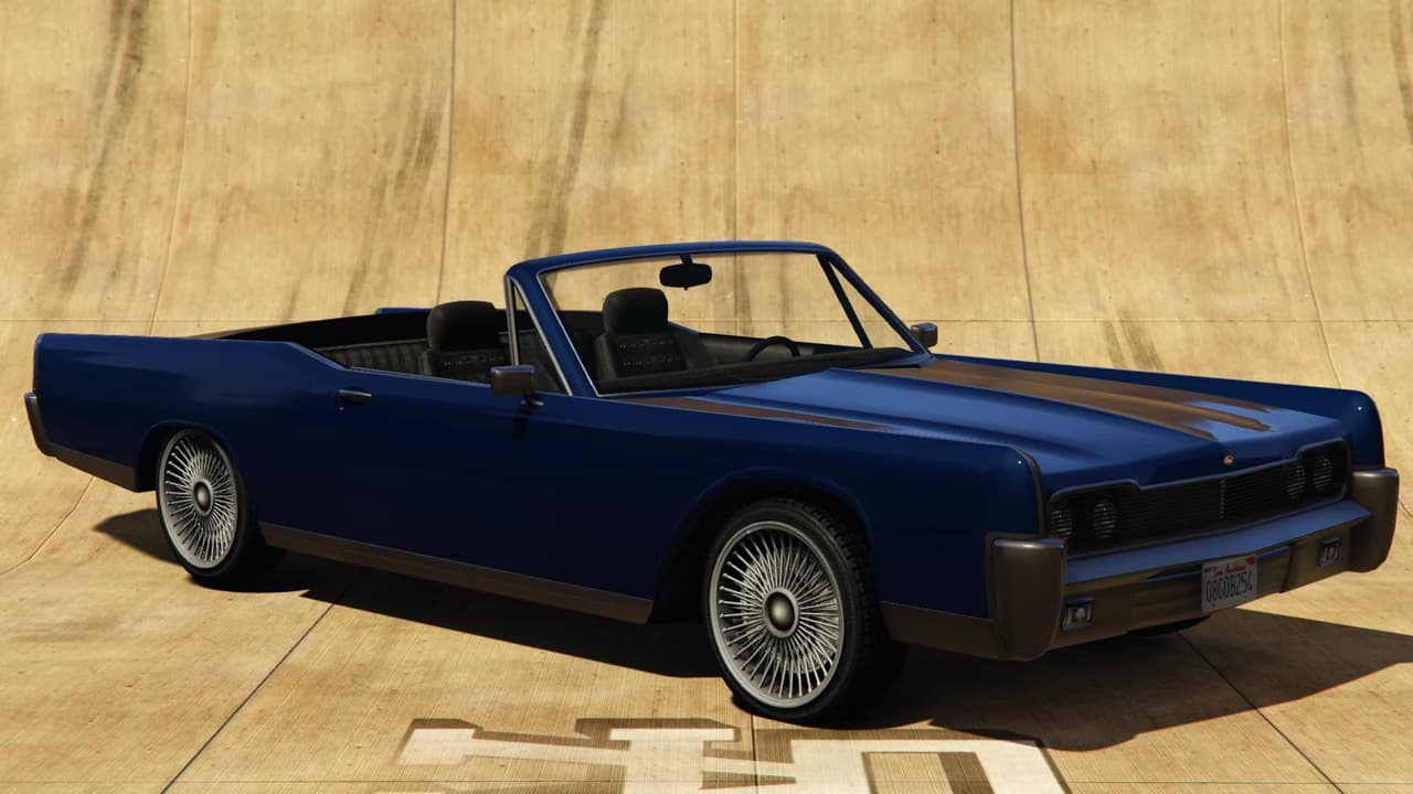 A blue Vapid Chino convertible lowrider on wire wheels, front three-quarter view.