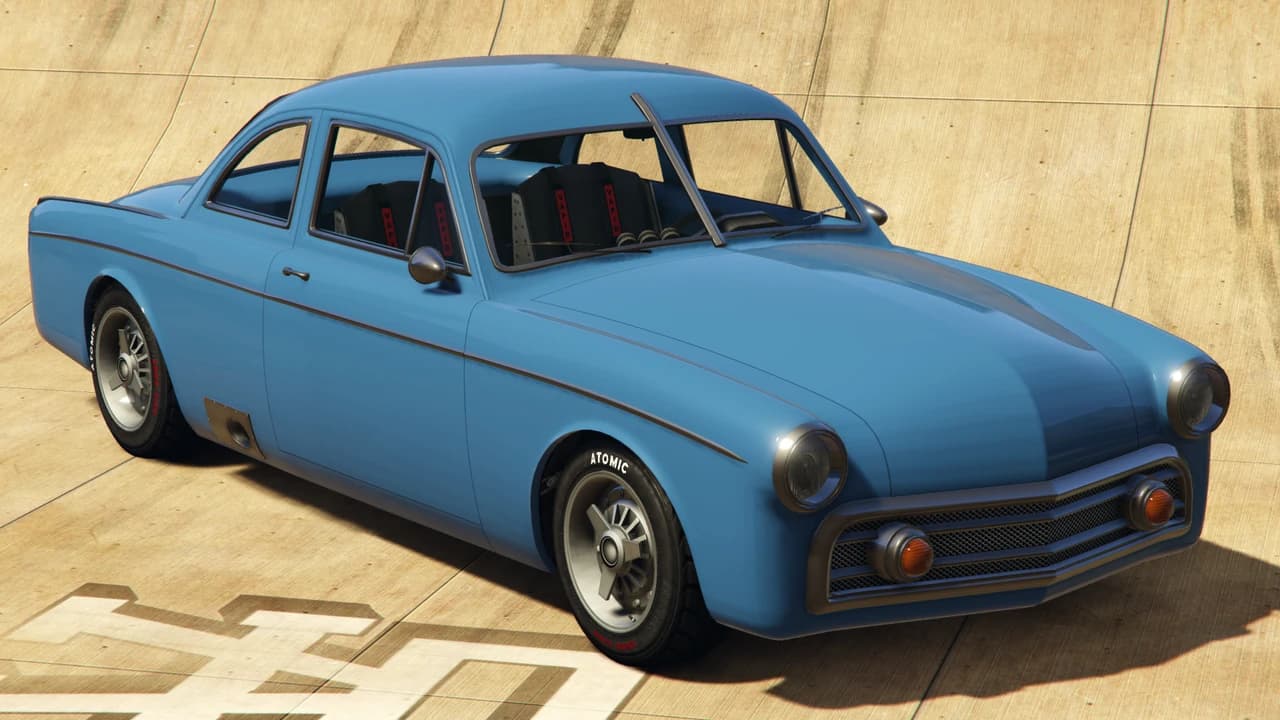 A blue Vapid Clique with a roll cage, front three-quarter view.