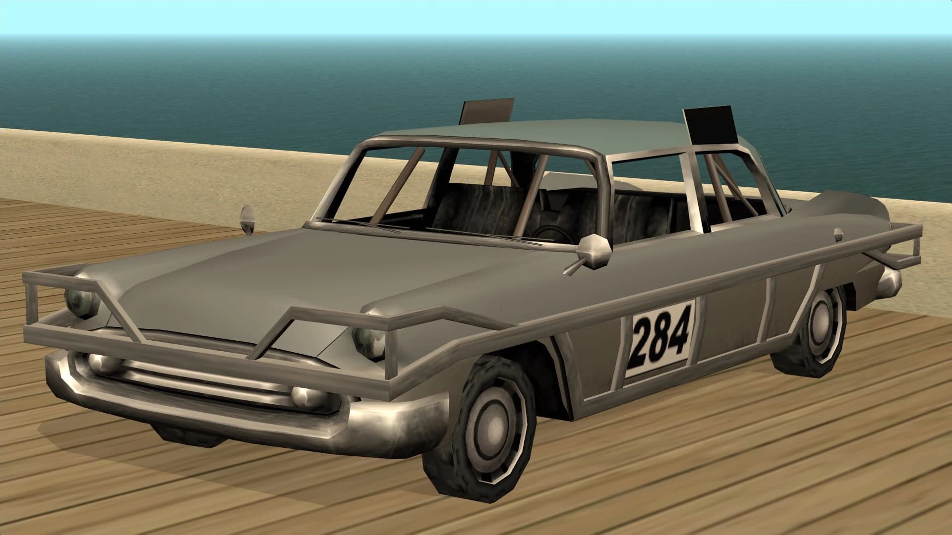 The Bloodring Banger, a stripped and numbered demolition-derby saloon, front three-quarter view.