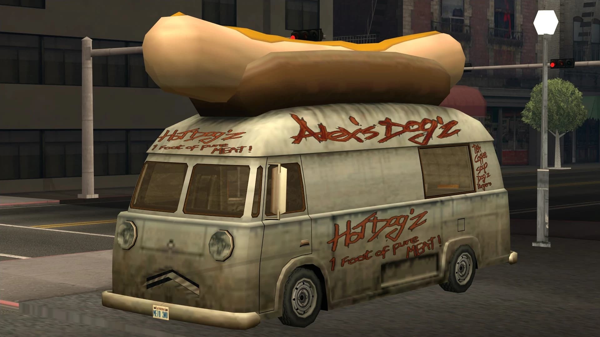 The Hotdog, a catering van carrying an oversized hot dog on its roof, front three-quarter view.