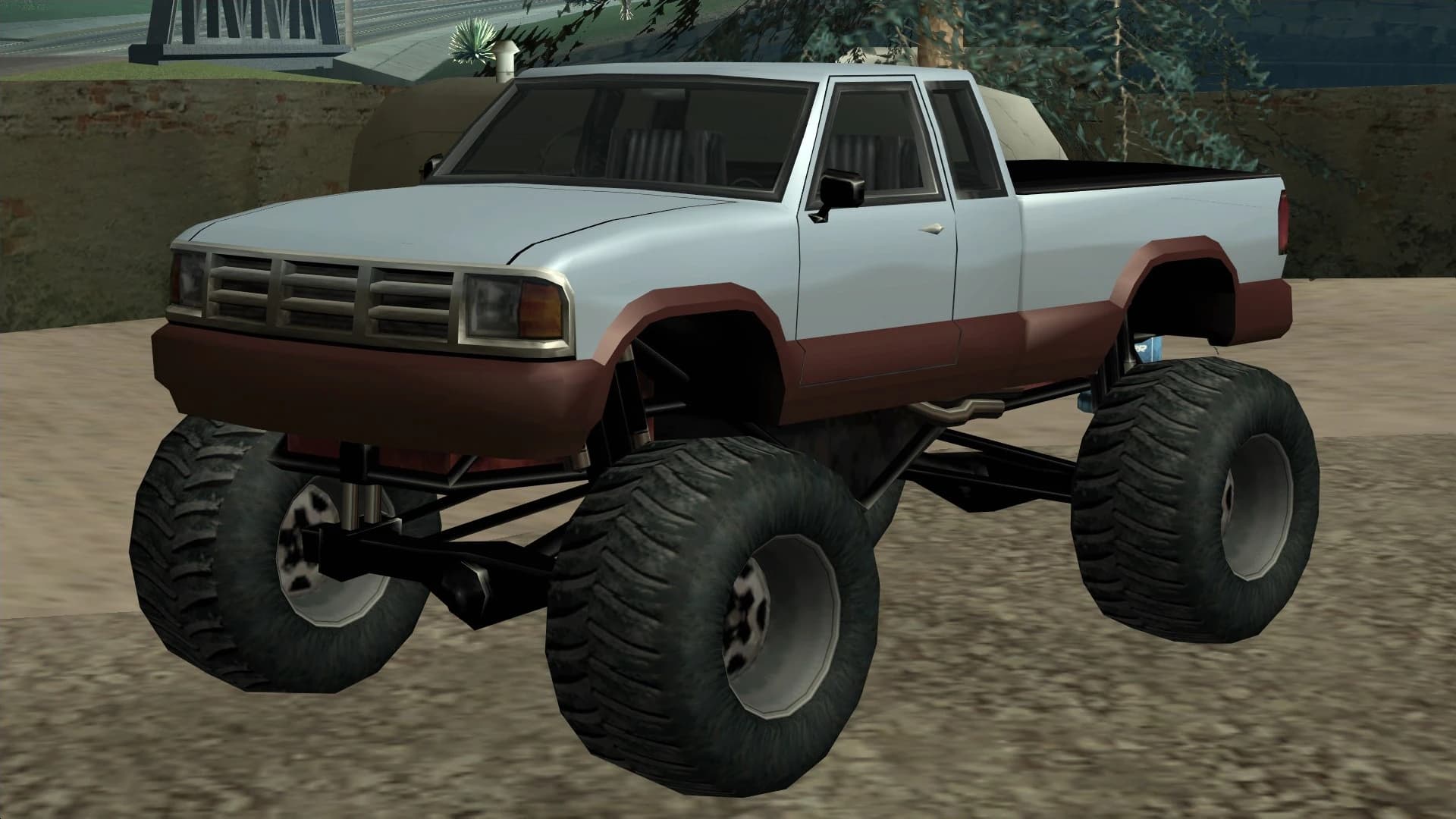 The Monster, a pickup body raised on outsized off-road tyres, front three-quarter view.
