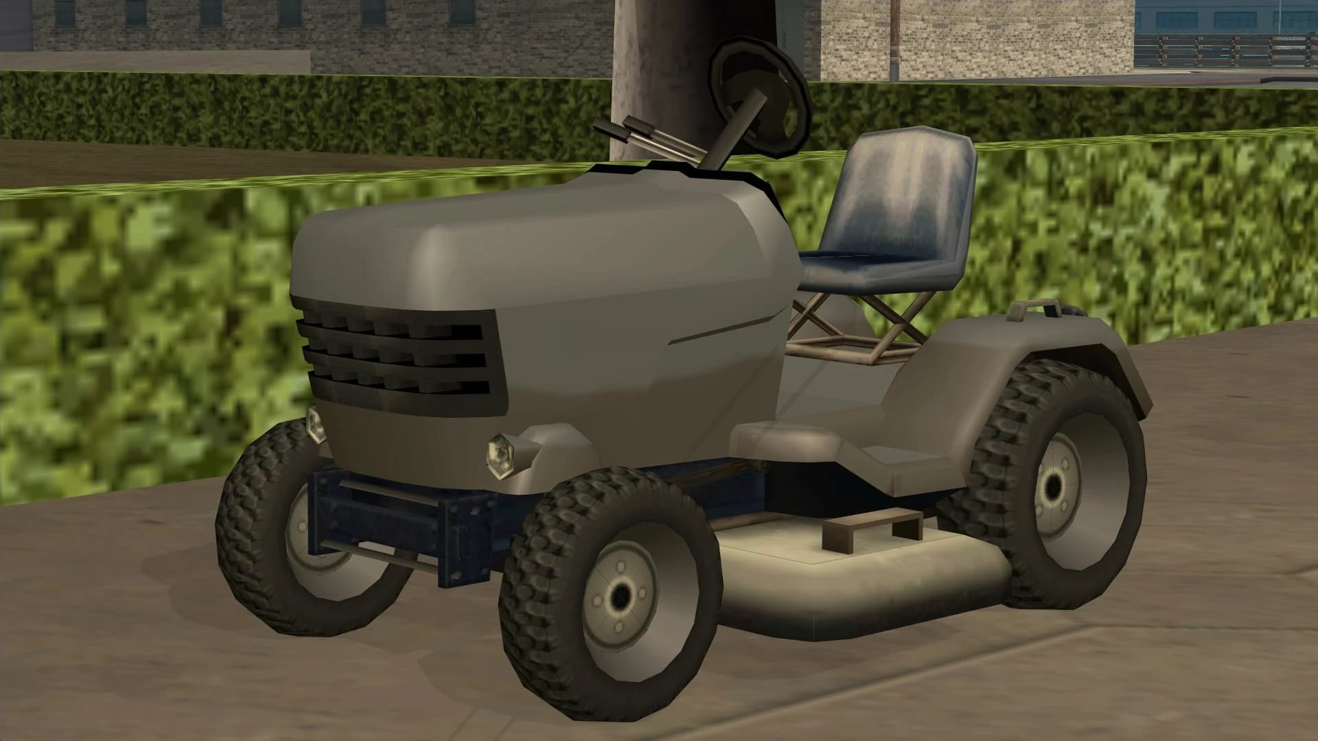 The Mower, a small ride-on lawn mower, front three-quarter view.