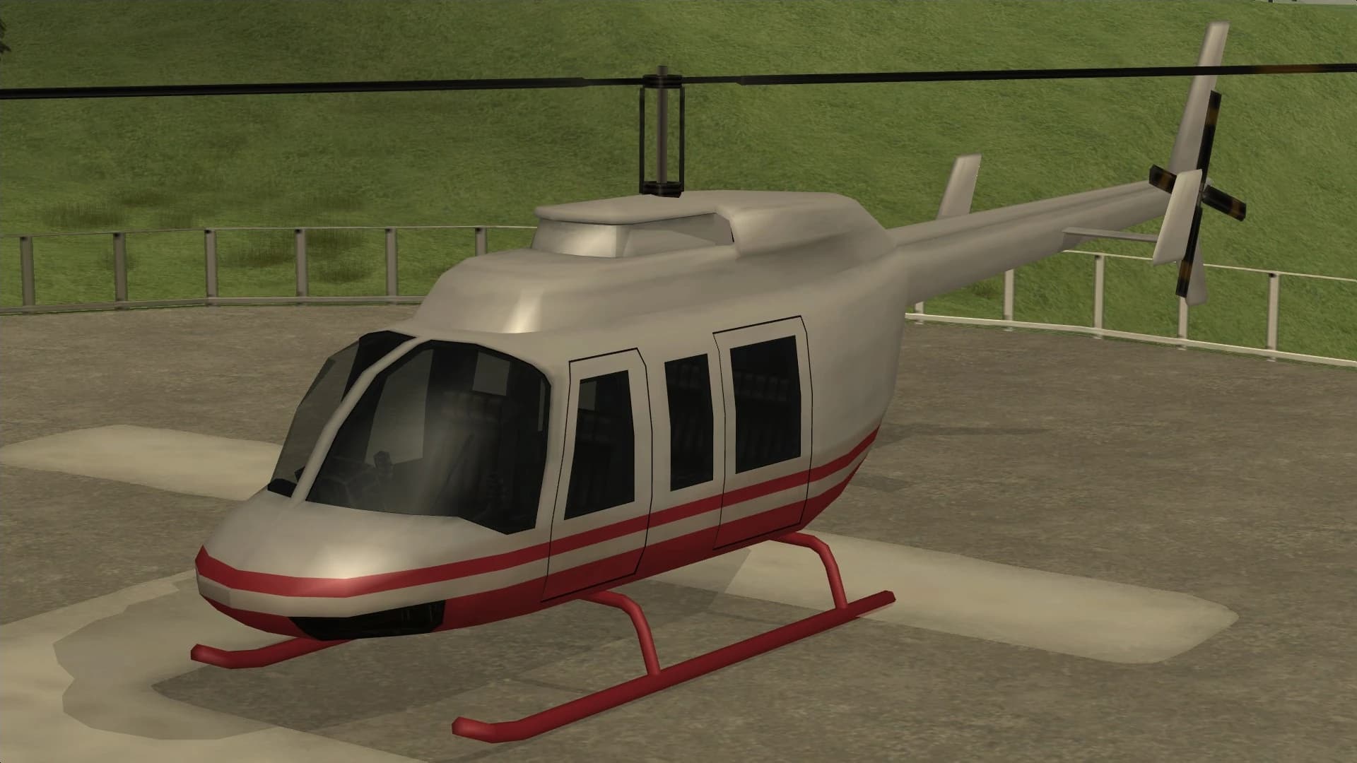 The Maverick, a light four-seat helicopter on a helipad, front three-quarter view.