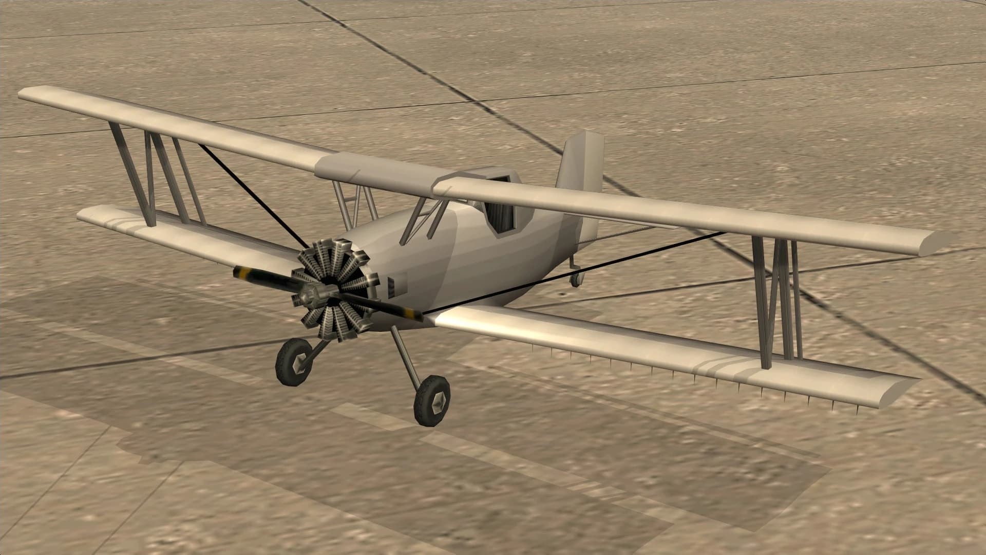 The Cropduster, a single-engined biplane fitted with spray bars, front three-quarter view.