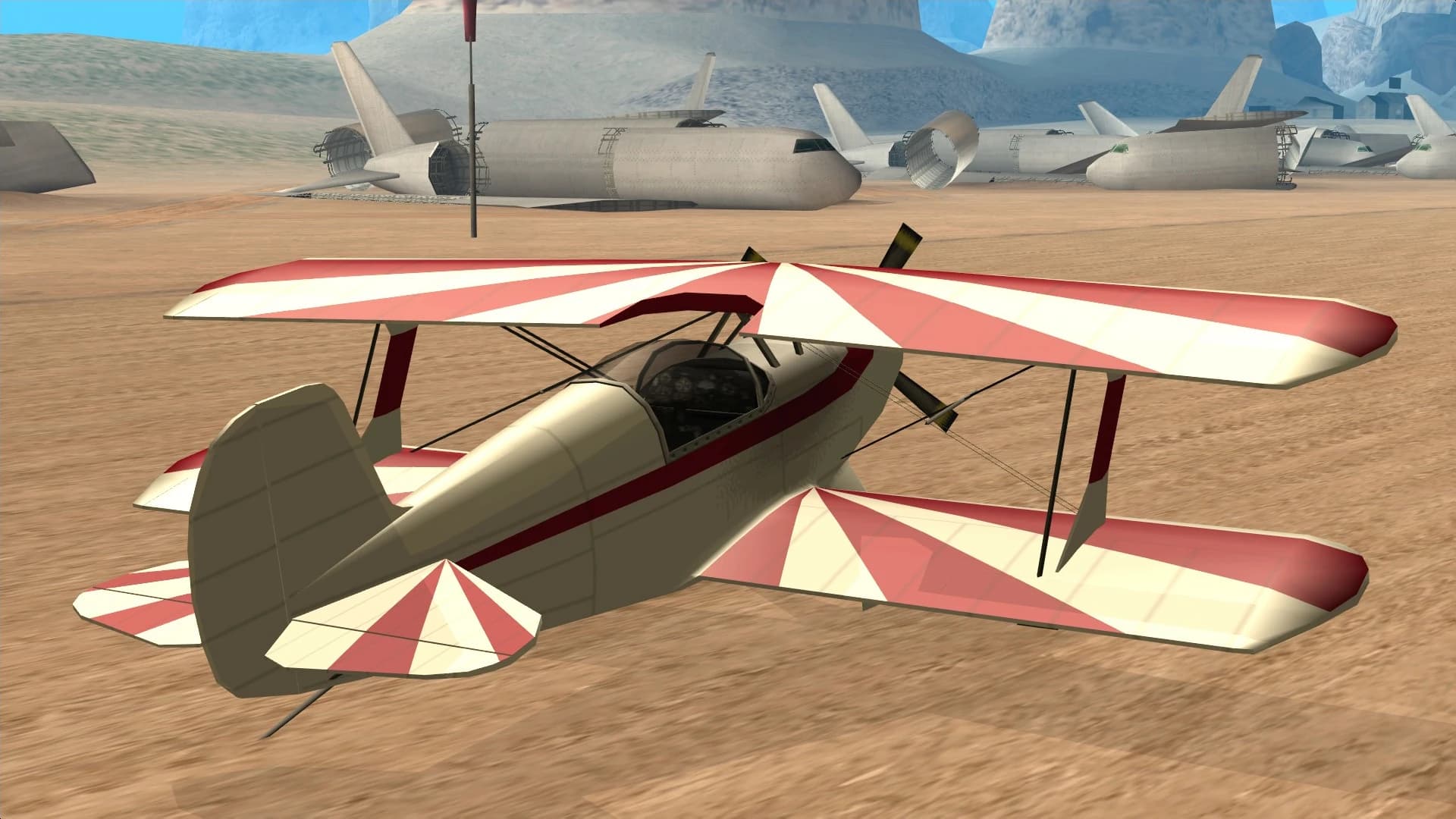 The Stuntplane, a single-propeller aerobatic biplane, rear three-quarter view.