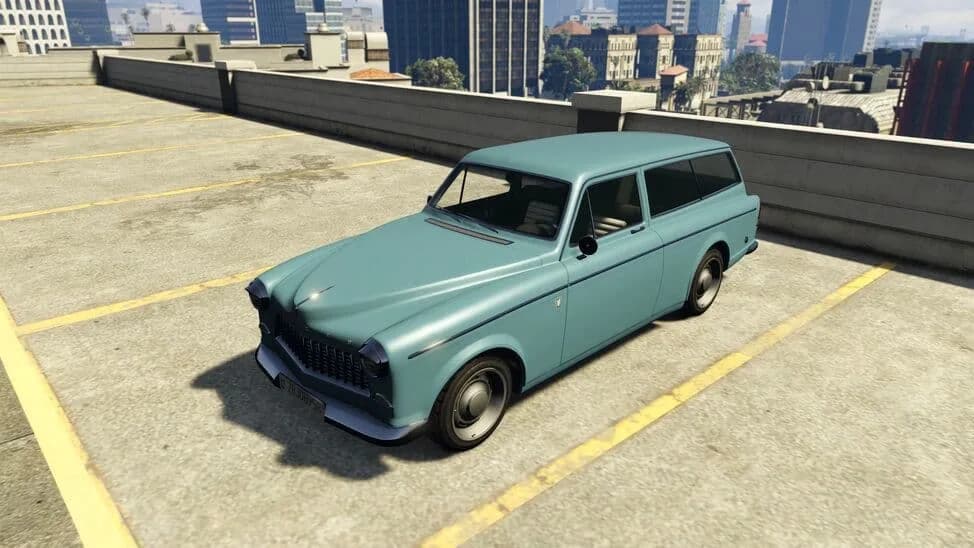 The Vulcar Fagaloa, a pale blue classic estate car, parked on a rooftop car park, in GTA Online.