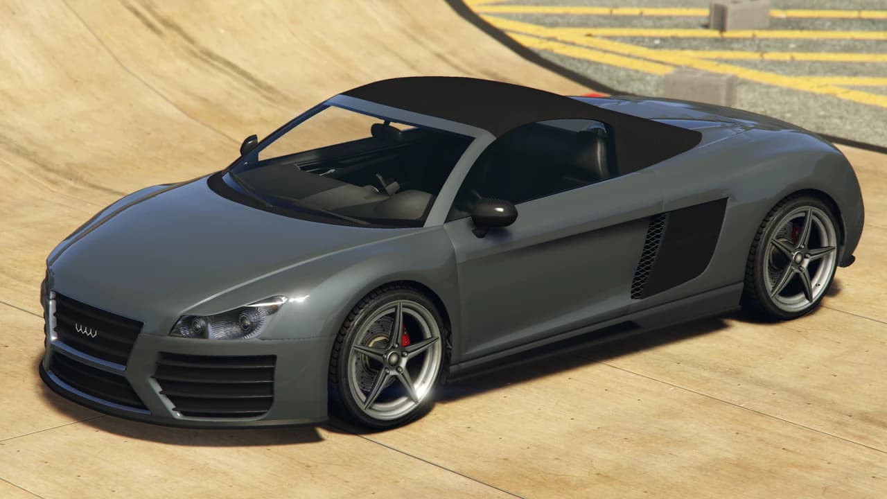 A grey Obey 9F Cabrio with its black soft top raised, front three-quarter view.